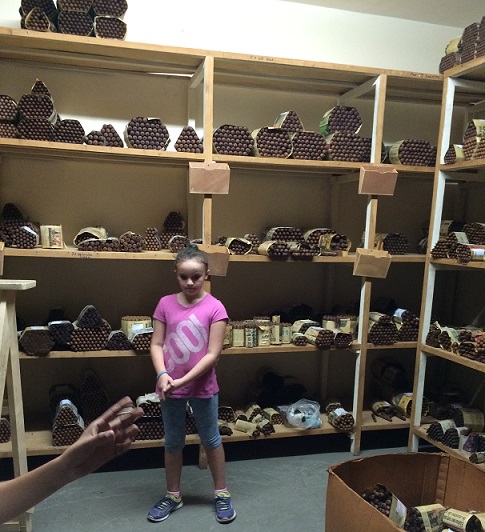 The smell in this room was strong as well. Groups of cigars are wrapped in newspaper while they age. 