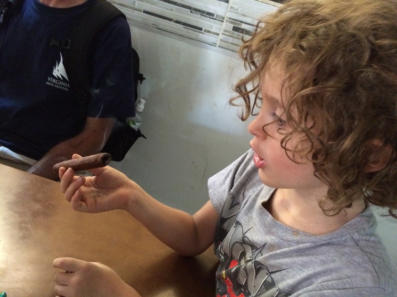 Of course the tour ended with a tasting. Neither kid, nor I, actually took a puff, but they had fun pretending. The smells from the fermenting room were enough for all of us.