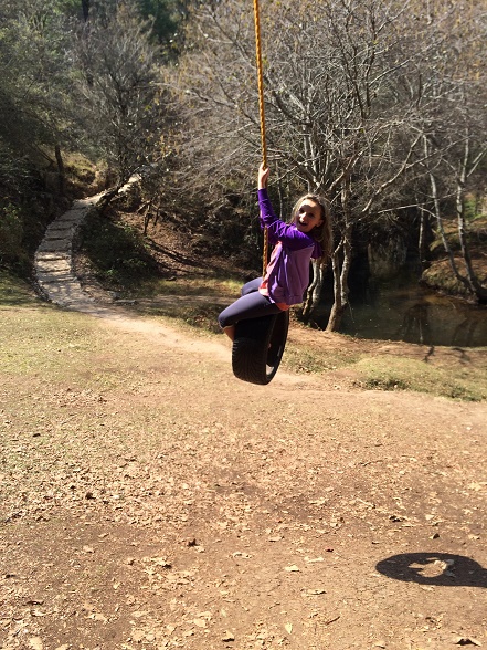 The kids were a lot happier when we walked around the park (and away from the arch) and found a small stream and two tire swings...that is until Ken hopped on the tire swing with Ela. She didn't care for that too much.