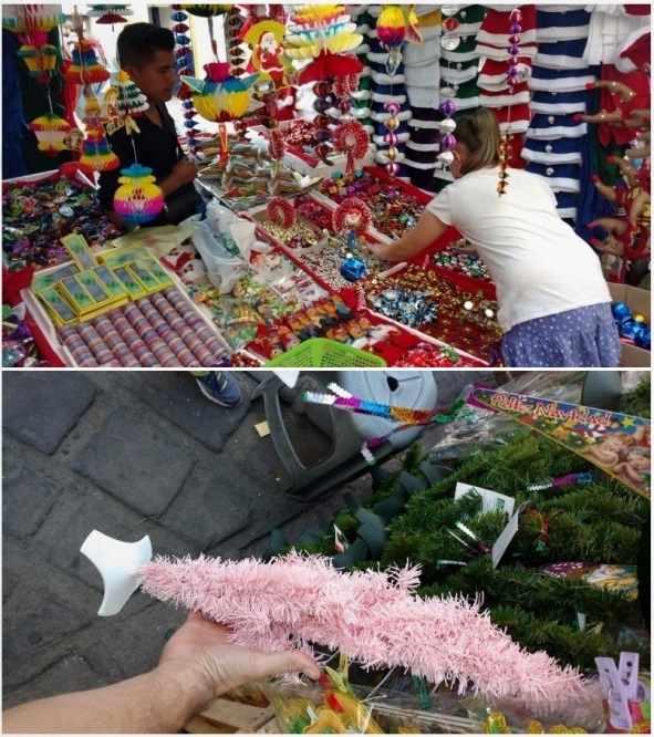 Ela looking through the ornaments (above). Our pink, collapsible, wire, tree (below). 