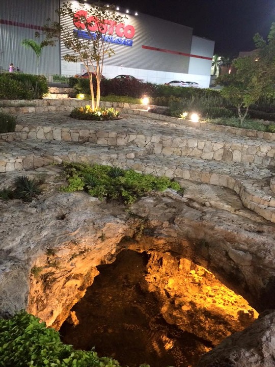 A cenote in the parking lot.