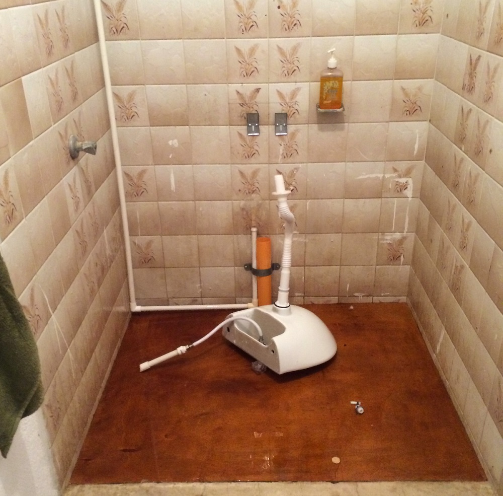 You are looking at a sink that has fallen off the wall onto the floor of what was once a shower (they repurposed the plumbing). This was inside the girls bathroom of the school where Mick taught in Guatemala. 