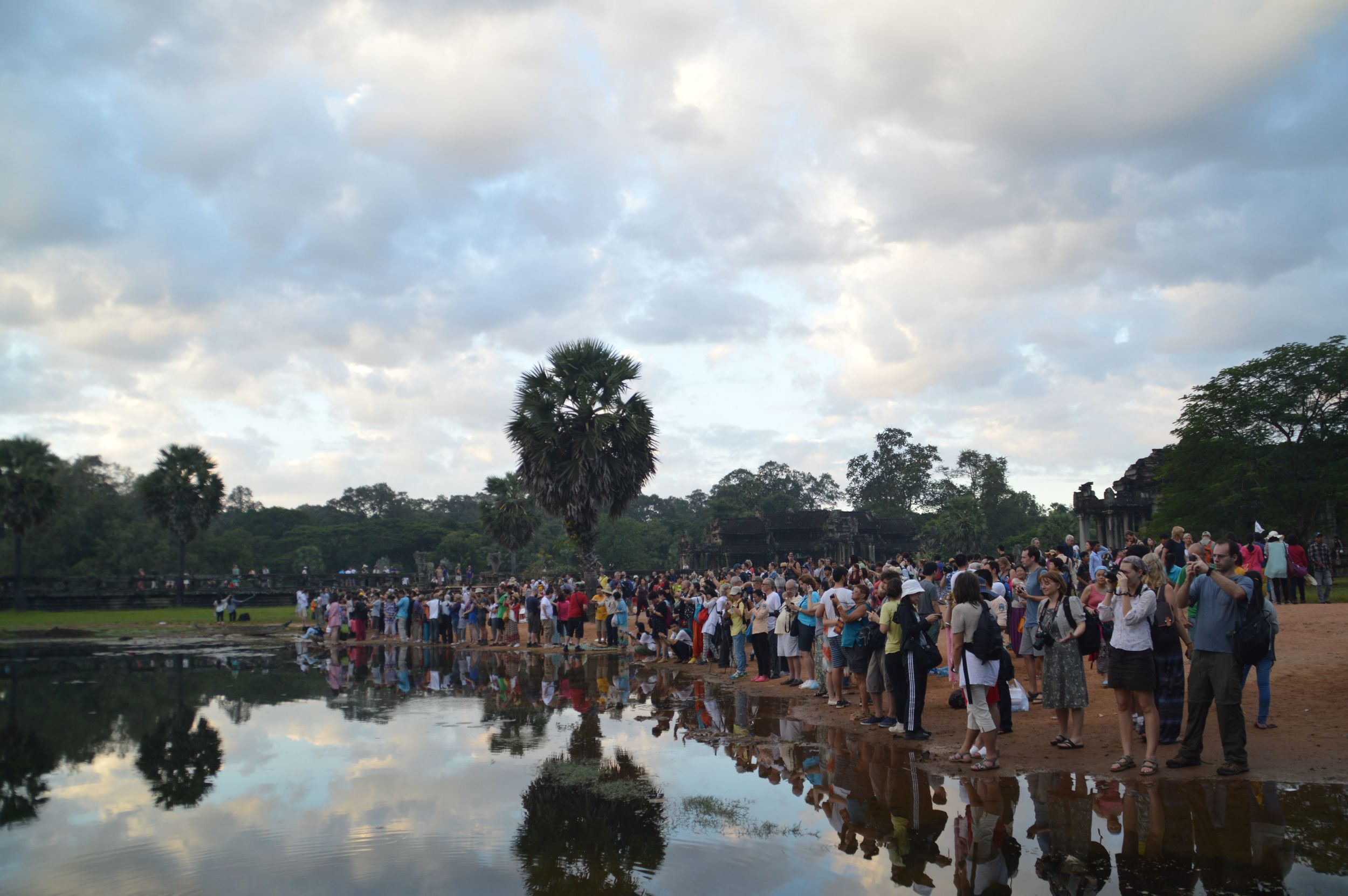 an overcrowded Angkor Wat at dawn