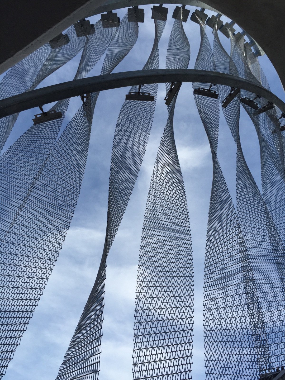  The architect selected a twisted stainless-steel mesh material. Encompassing over 9,000 linear feet, the panels are held together by 250,000 individual welds completed by hand by the panel manufacturer’s fabrication team 