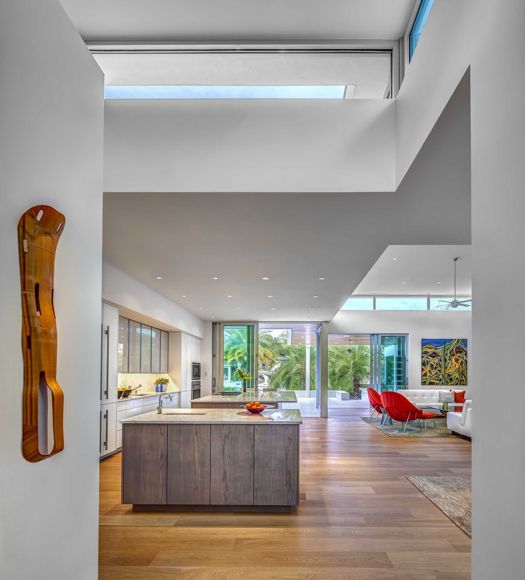  Inside, the openness of the house forms an ideal setting for entertaining. The living, dining room, and kitchen flow seamlessly into one another and continue onto the rear terrace. From this public sequence of spaces, the floorplan purposely progres