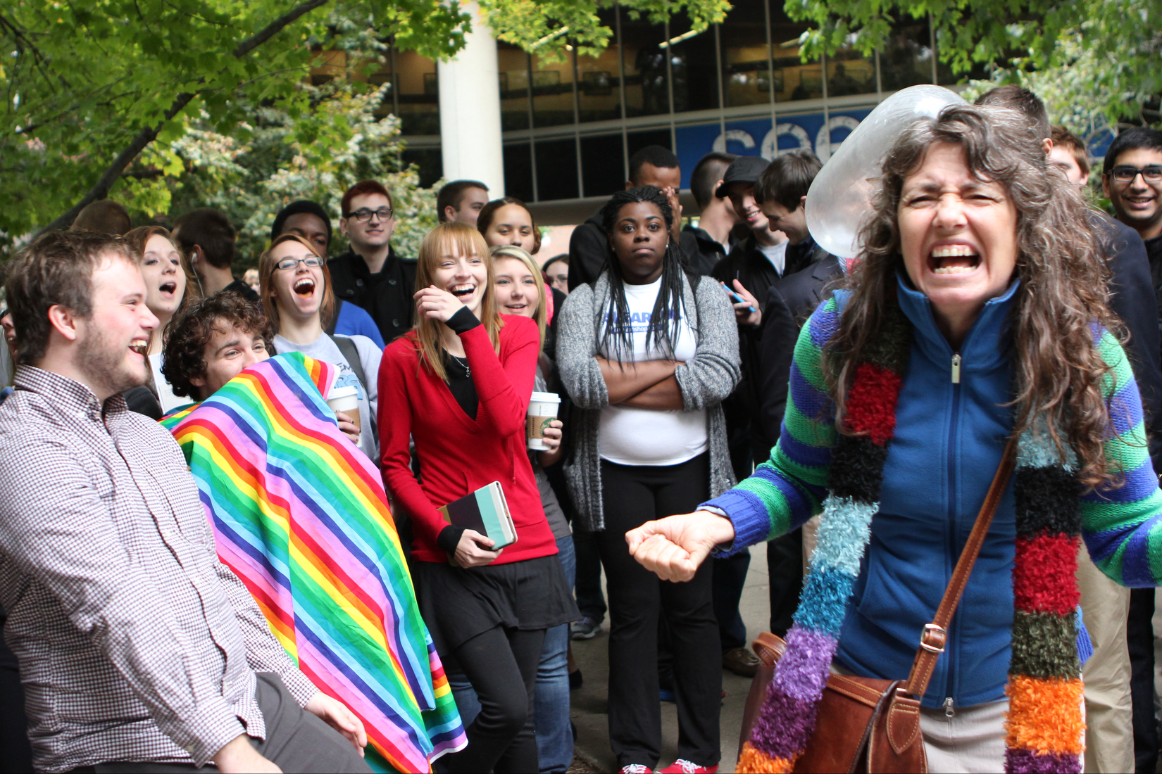 Students, including protesters with the University of Kentucky's LGBT support group the OUTsource, react as an inflated condom collides with Sister Cindy as she delivers a sermon on campus that condemns all sex practices that are not between a marri