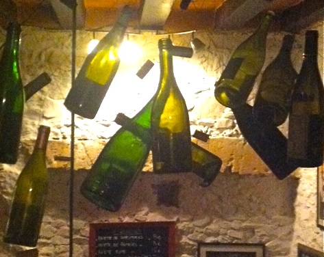 Suspended bottles at Le Cercle Rouge in Angers