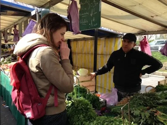 Tasting fresh herbs at the market