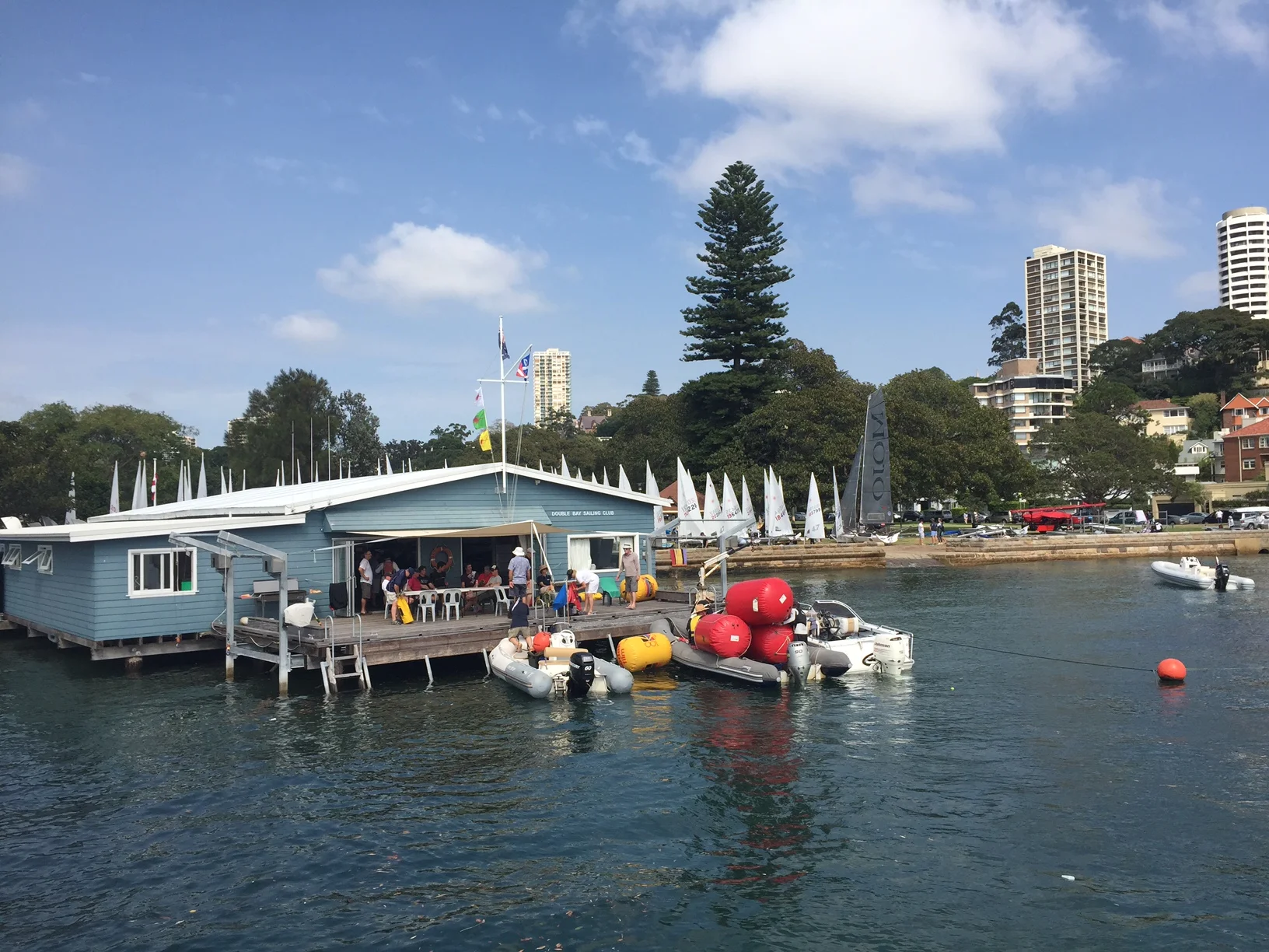 Nothing finer than a well populated DBSC Clubhouse in the sun, rescue boats at the ready and over 100 Lasers in the park