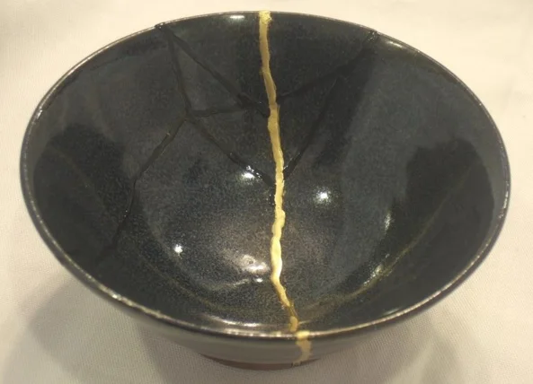 Kintsugi—the Japanese art of repairing broken pottery with gold. The idea behind it is that the piece becomes more beautiful and valuable because it has been broken and has a history.