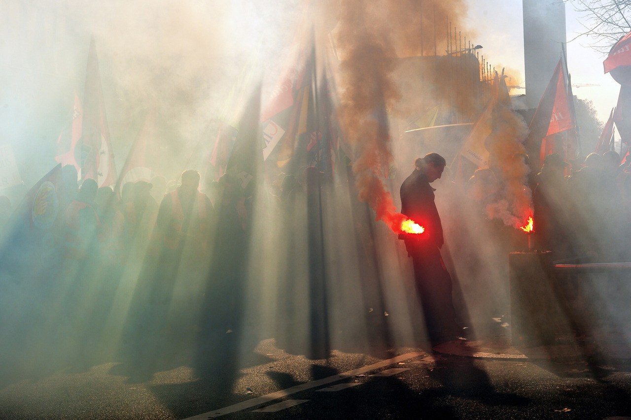 timelightbox:

Nov. 14, 2012. A man holds a flare as thousands of people from France and Belgium demonstrate during an anti-austerity protest in Lille, France. (photo: Philippe Huguen—AFP/Getty Images)
From escalating violence in the Gaza Strip and …