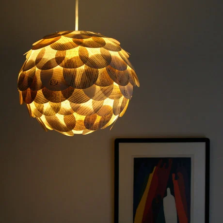 curiositycounts:

Gorgeous artichoke paper lanterns made from old books by designer Allison Patrick. 