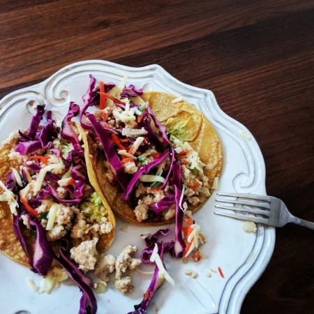 Ground Turkey (sautéed with onions, red bell pepper, and a touch of cumin) + Slaw + Shredded Cheese and Avocado