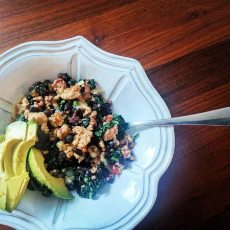 Ground Turkey (sautéed with onions, red bell pepper, and a touch of cumin) + Black Beans + Greens + Melted Cheese and Avocado