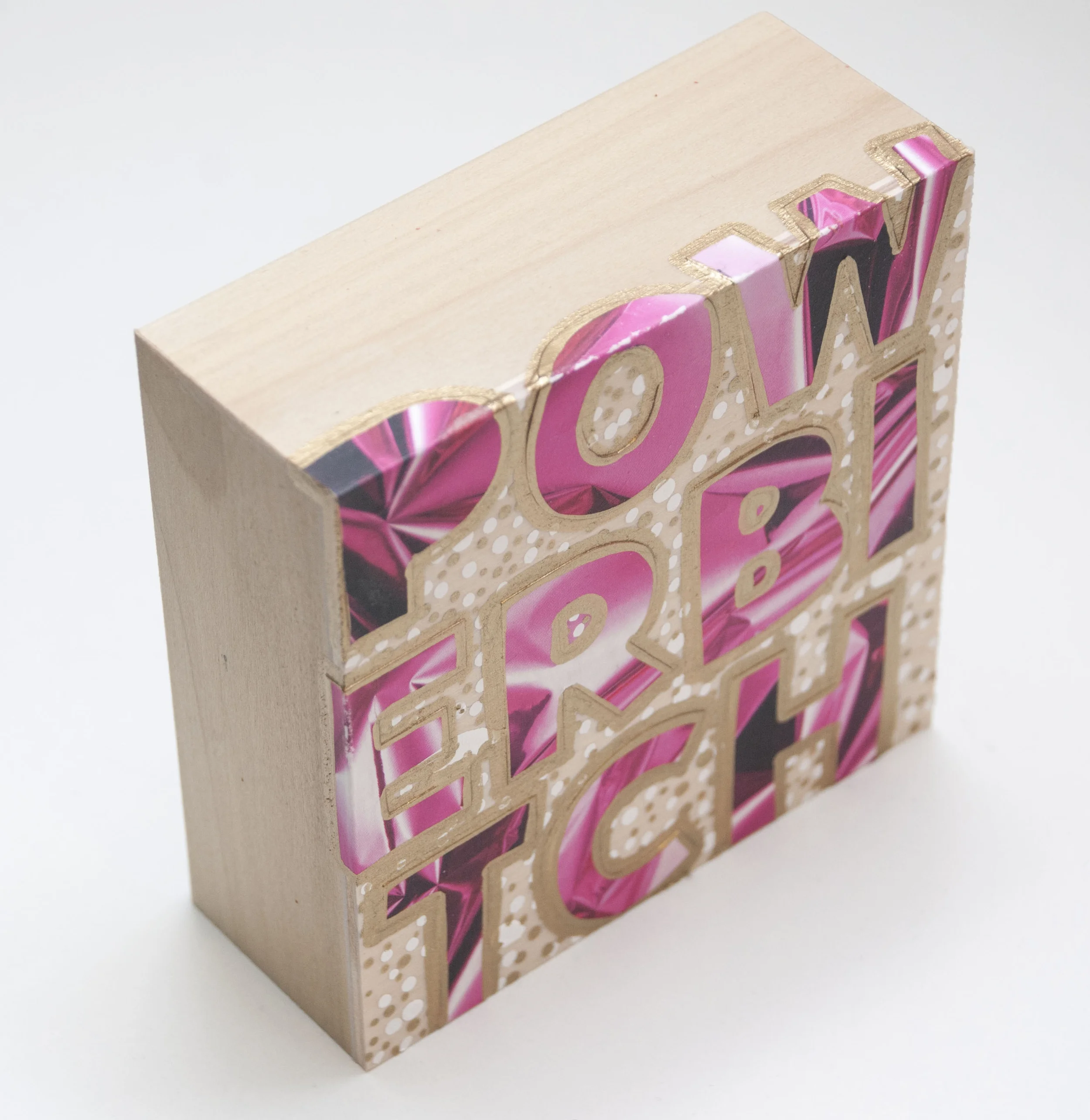 Powerbitch , 2016 Acrylic, enamel, and catalog pages on wood 4 x 4 x 1 5/8 inches