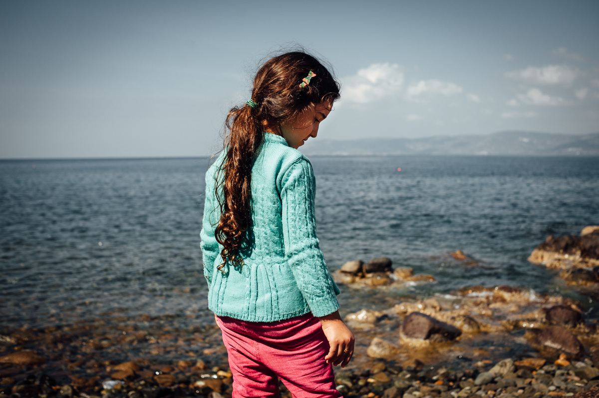 Mariam, a 6-year old Syrian refugee just after having crossed the sea between Turkey and Greece with her twin brother and mother. Oct 3, 2015.