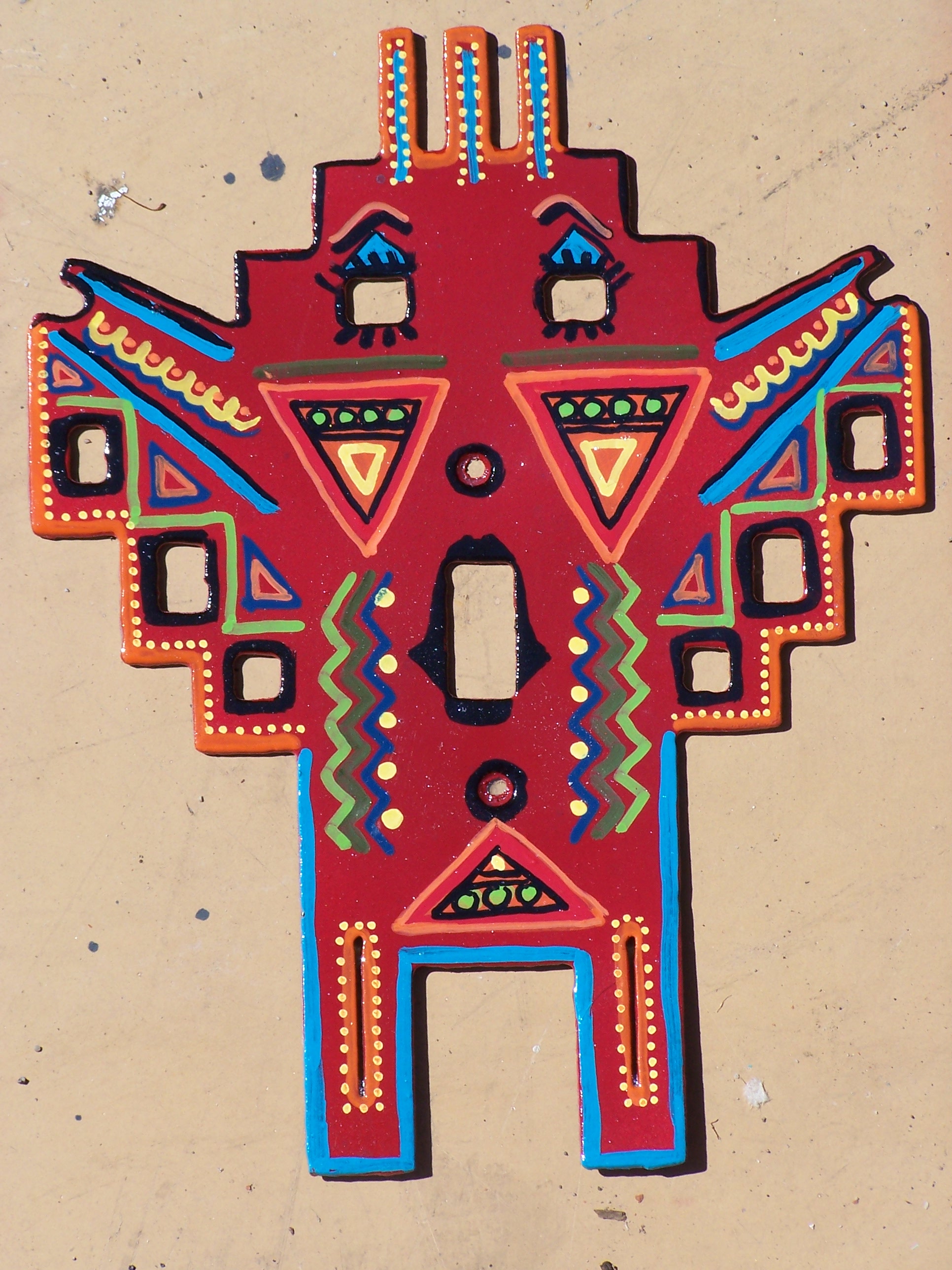  Metal switchplate in Native American shape inspires a geometric design. 