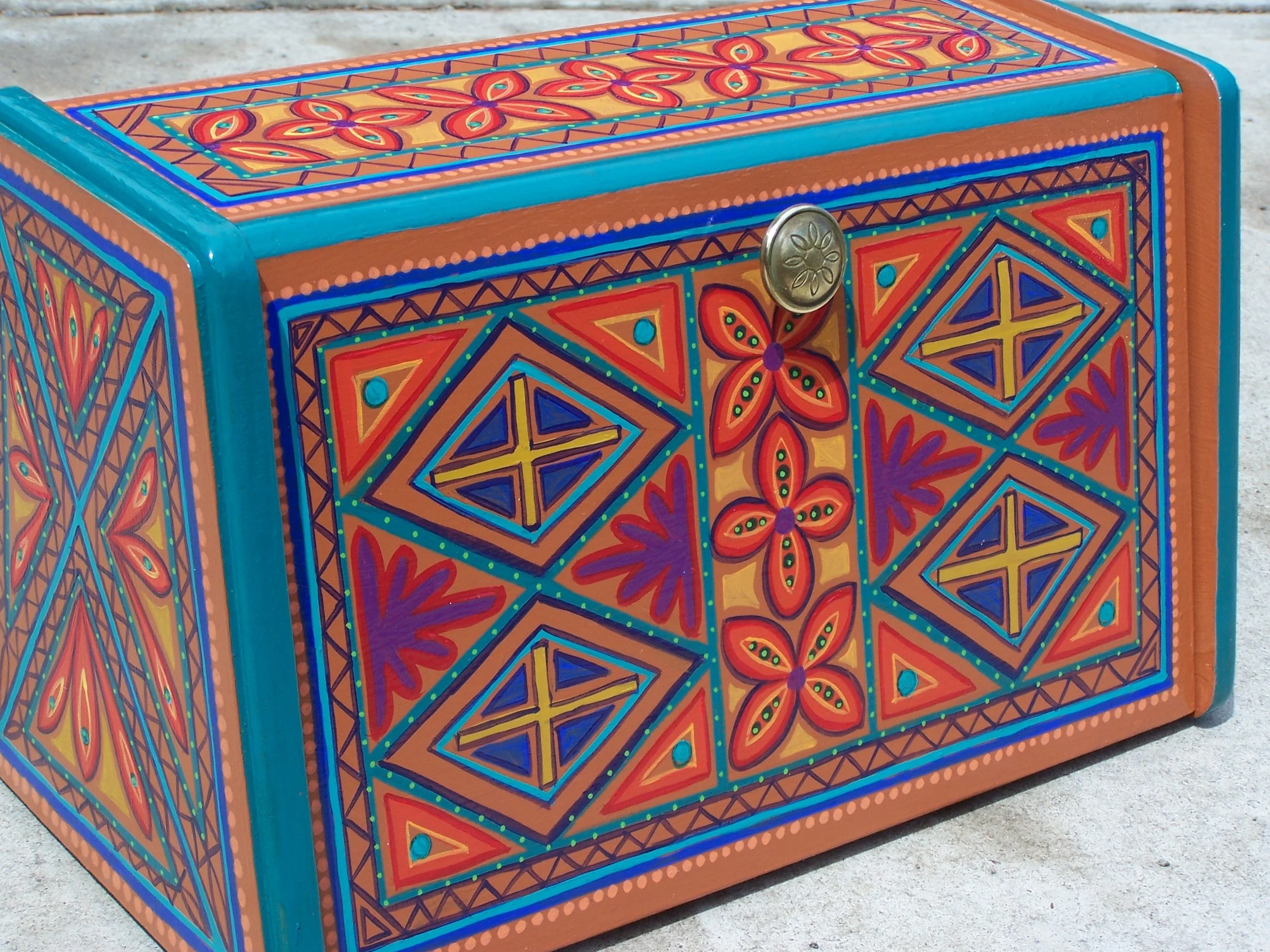  Ornate design covers this breadbox; some people use these to store letters and paperwork, all sorts of junk! 
