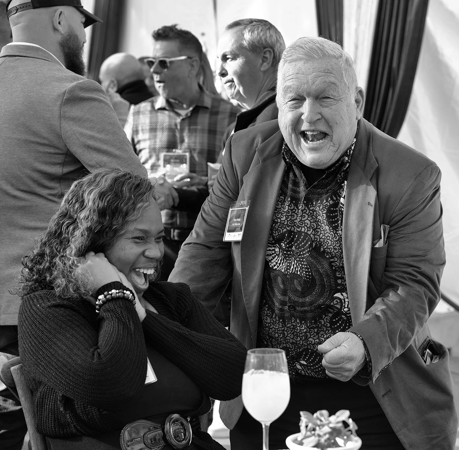 Guests laughing at networking event