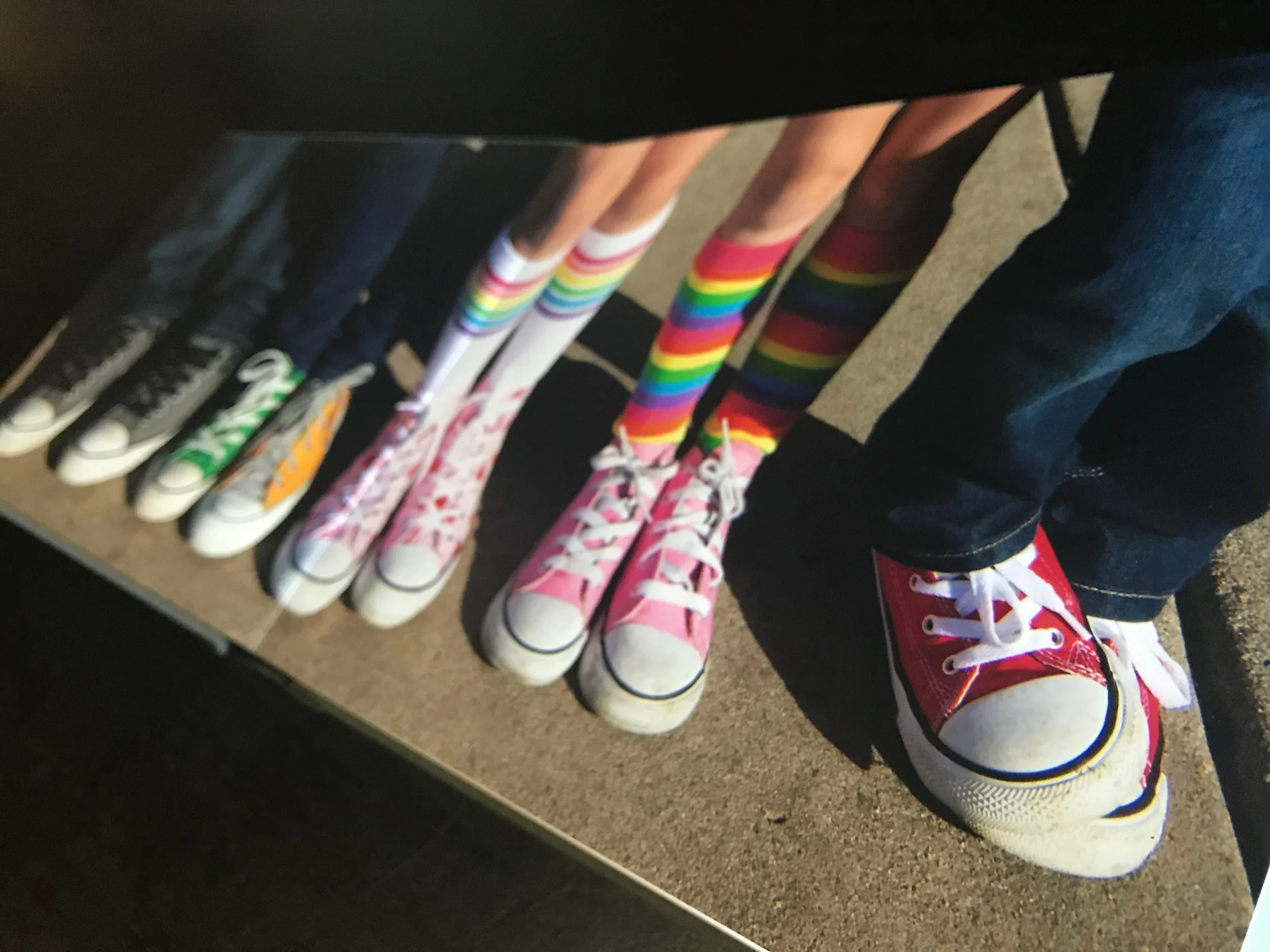 Colorful panoramic page spread of P family session photo album.