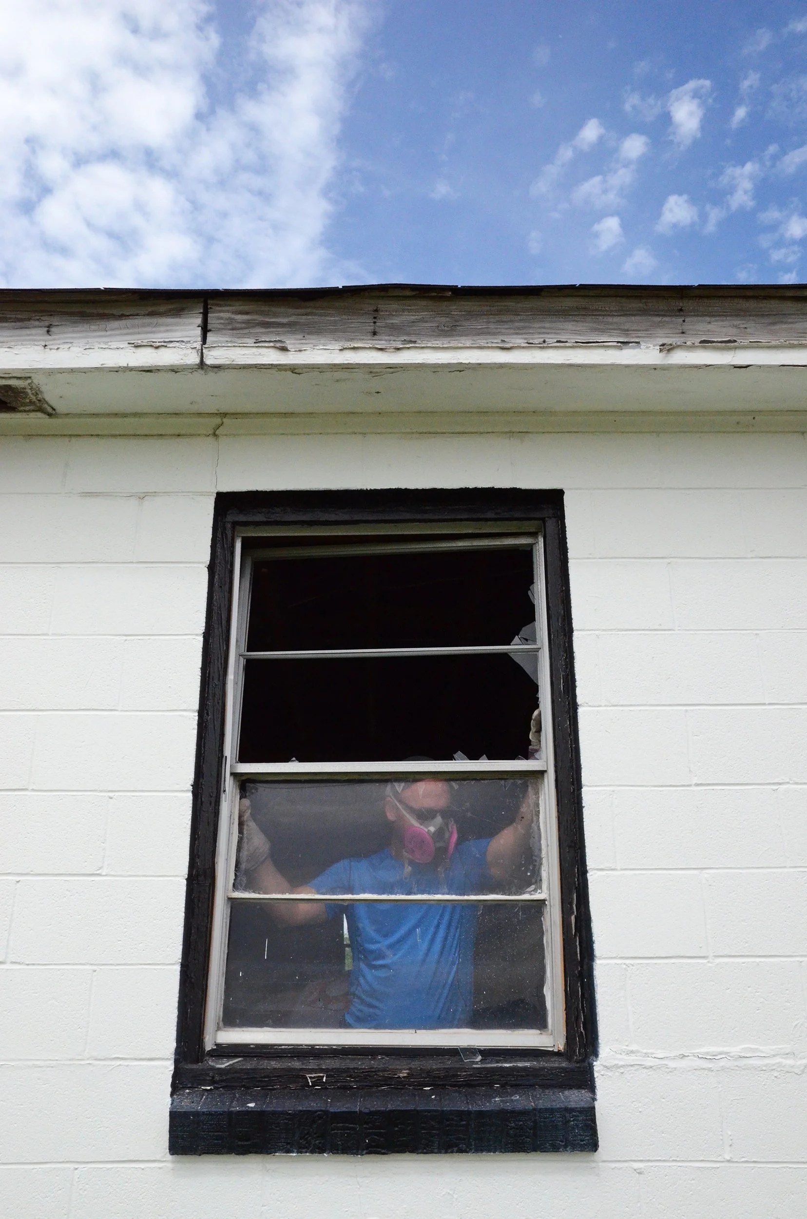 Volunteer working to repair a home through the Saint Bernard Project in New Orleans.