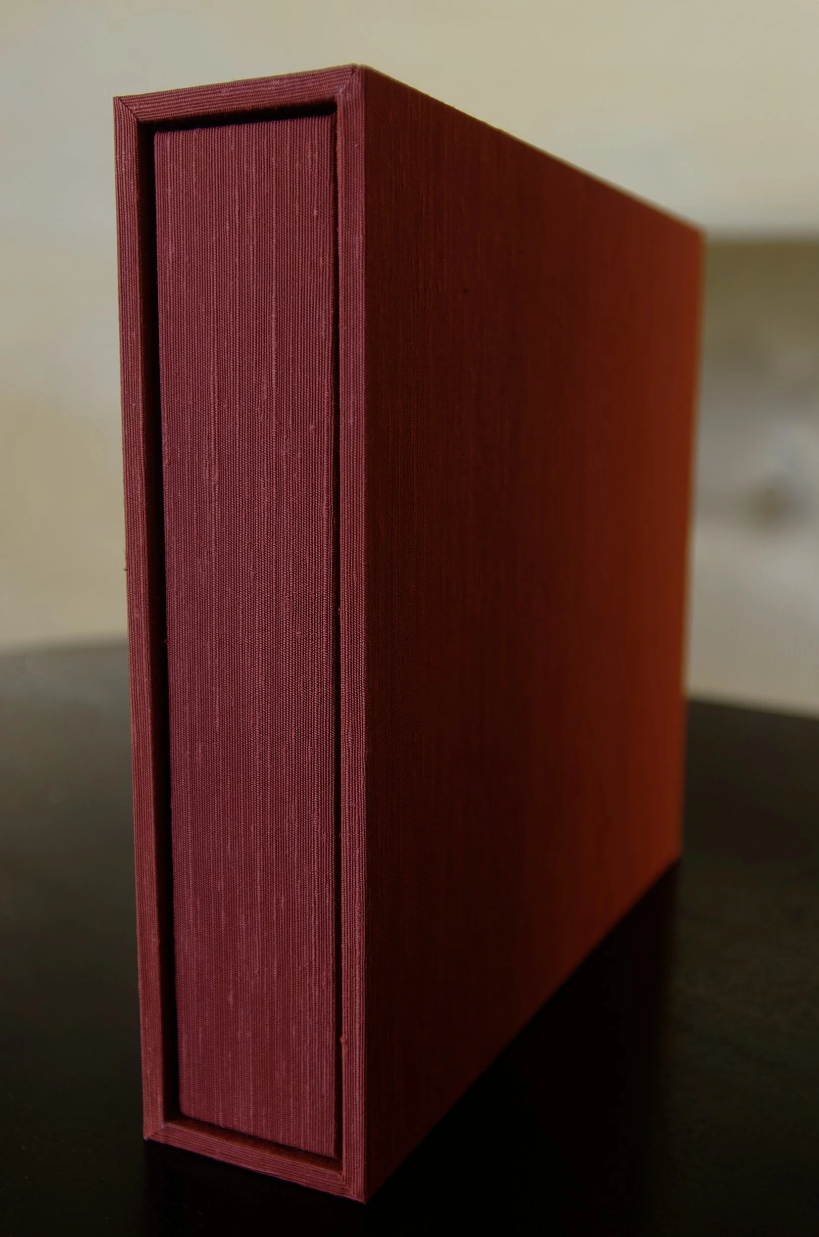 Hand-bound wedding album with textured red silk book cloth