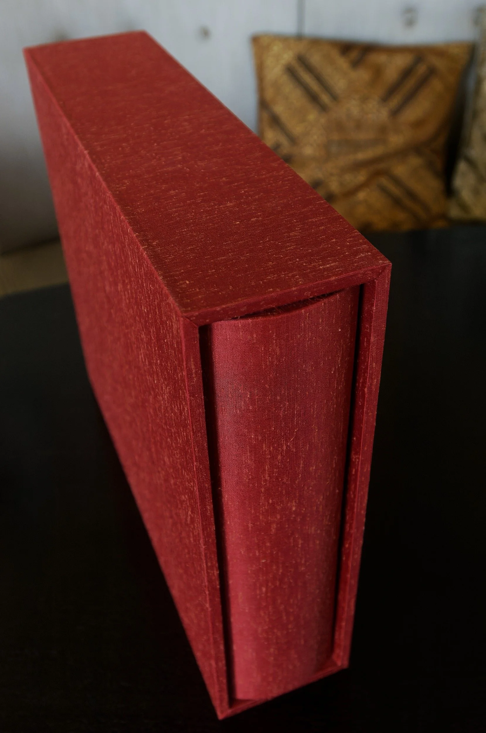 Red textured Japanese silk book cloth on album and slipcase