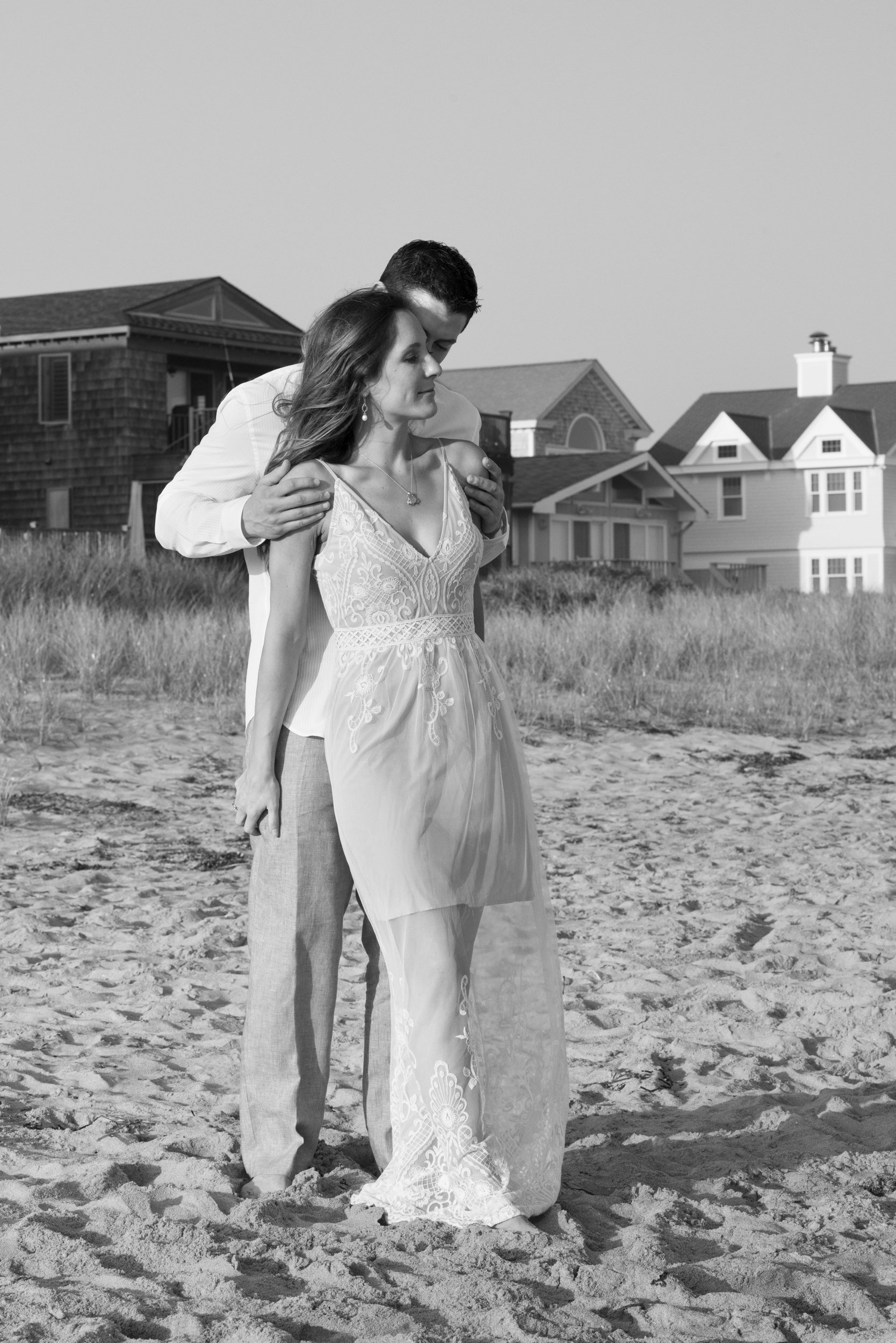 Elizabeth and Gregory standing together at the water's edge.