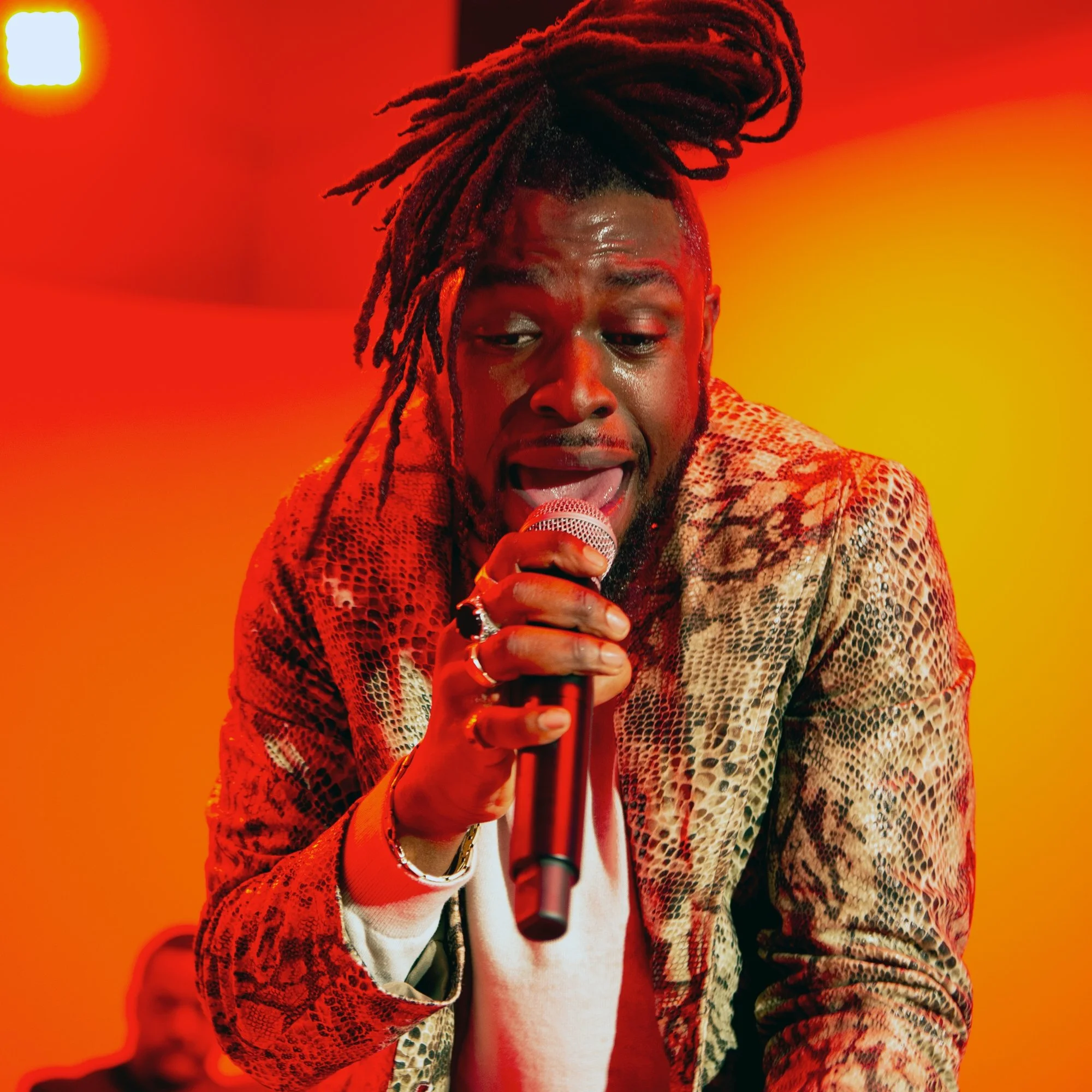 Energetic color still of Rick Express lead singer during music production in Brooklyn, New York for Hank Agency Group.