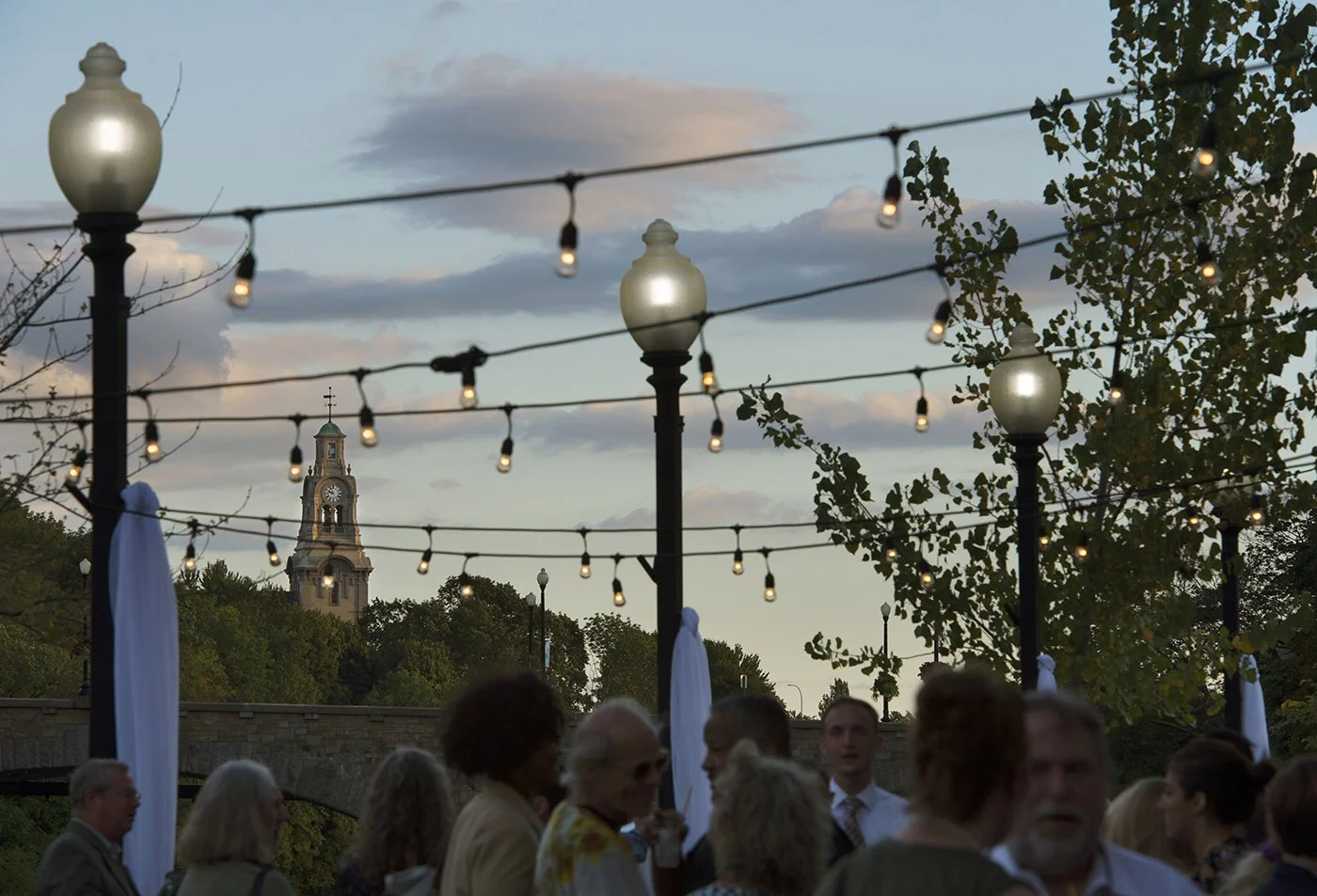 Pawtucket Congregational Church (The Temple of Restoration) peeking through string lights at downtown Pawtucket event
