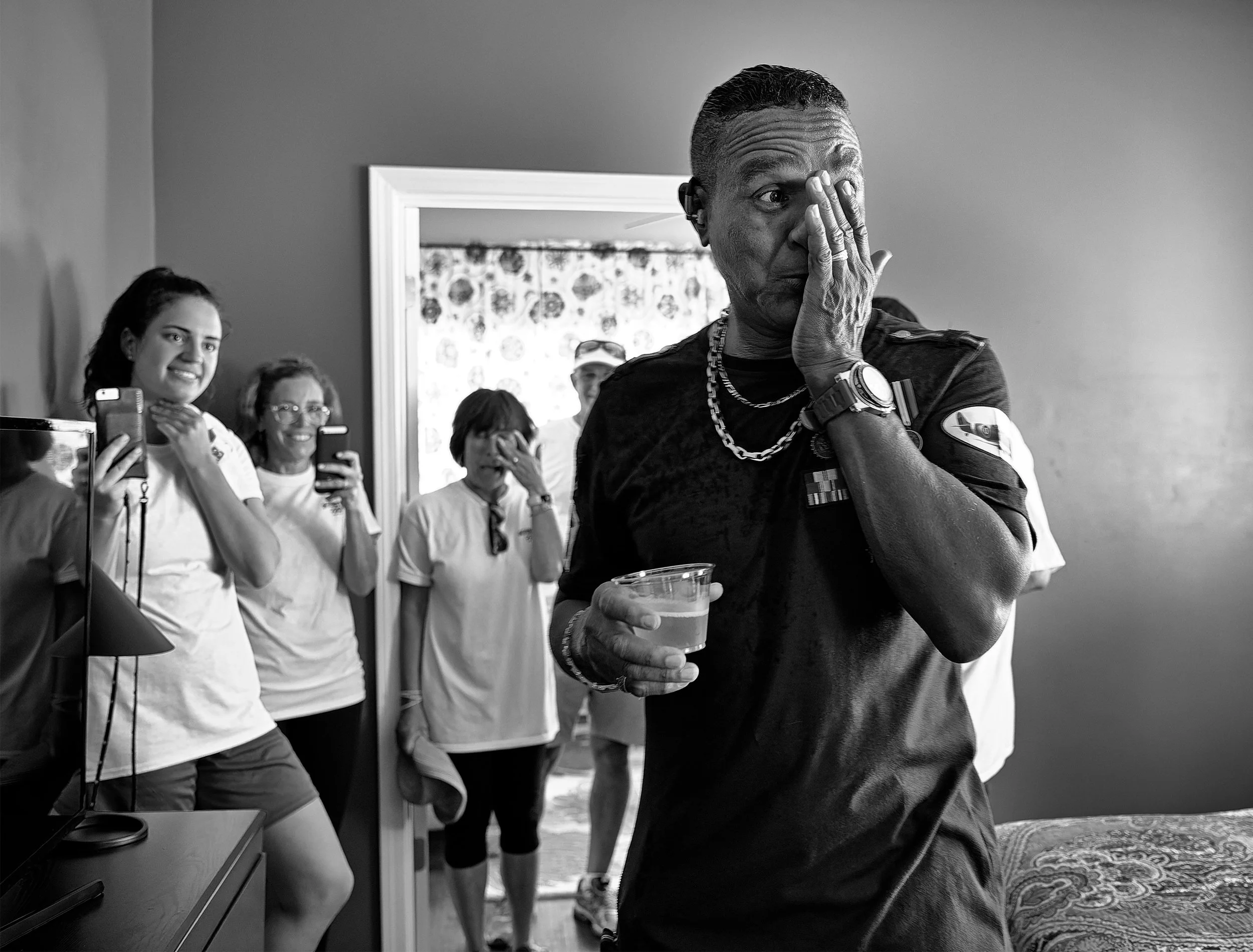 Emotional recipient and volunteers during Event Pros Take Action event in New Orleans, LA