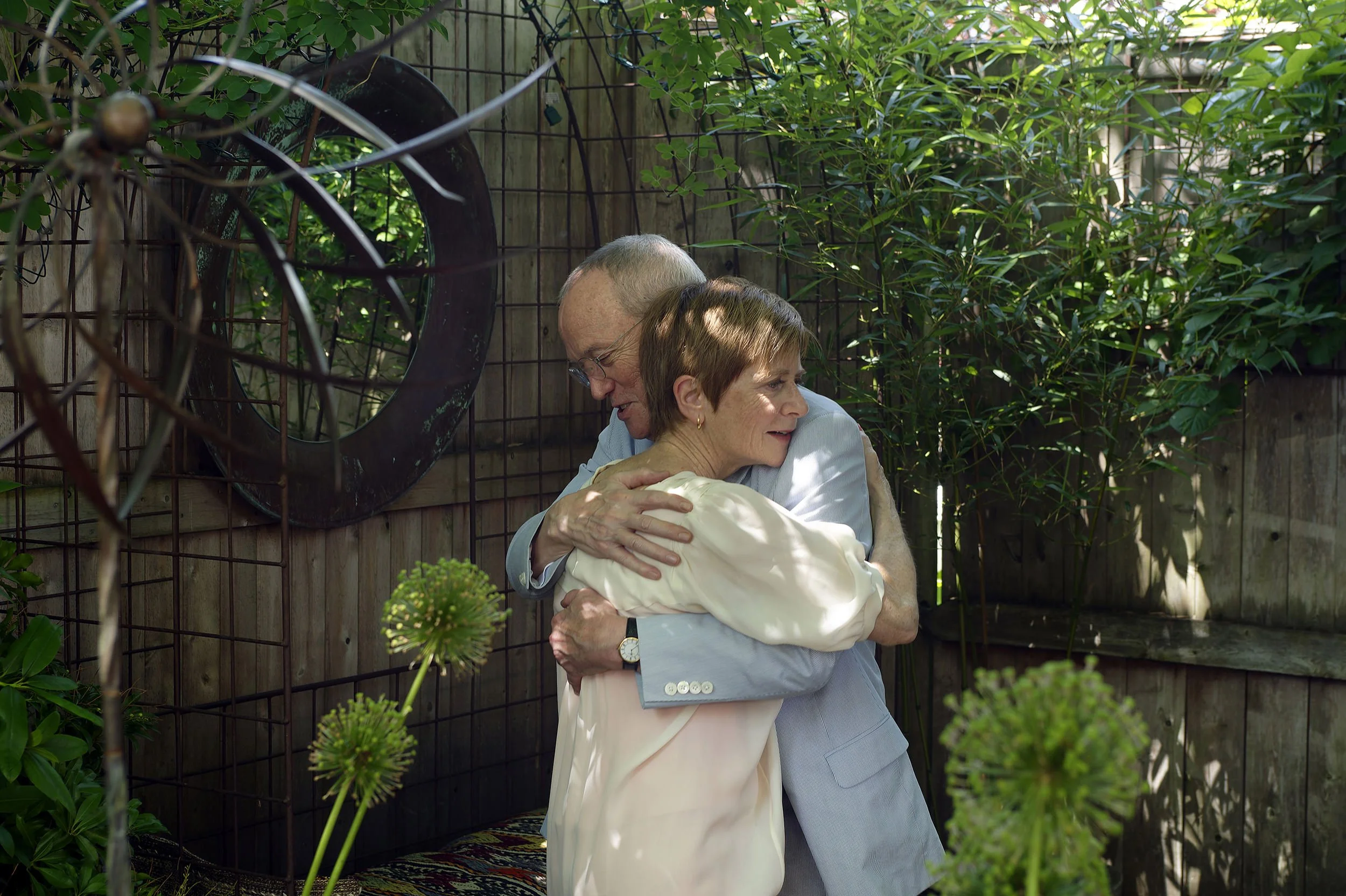 A candid portrait of Barbara and Robert hugging at their wedding anniversary celebration at Oleana in Cambridge, Massachusetts.