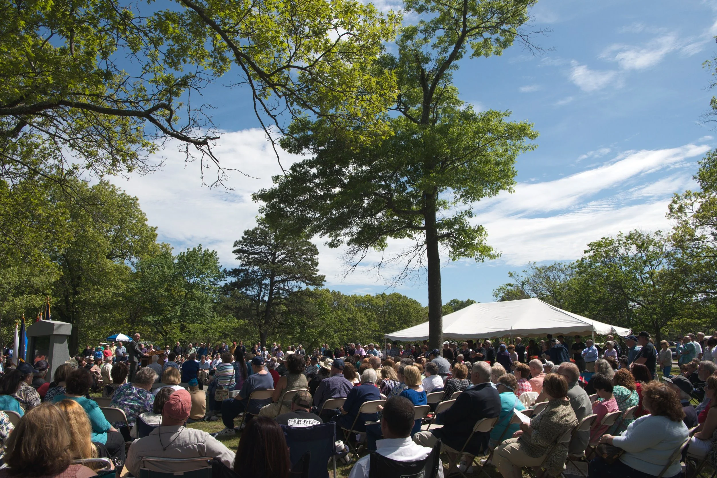 Speaker addressing attendees during the annual 21 Heroes Memorial Ceremony.
