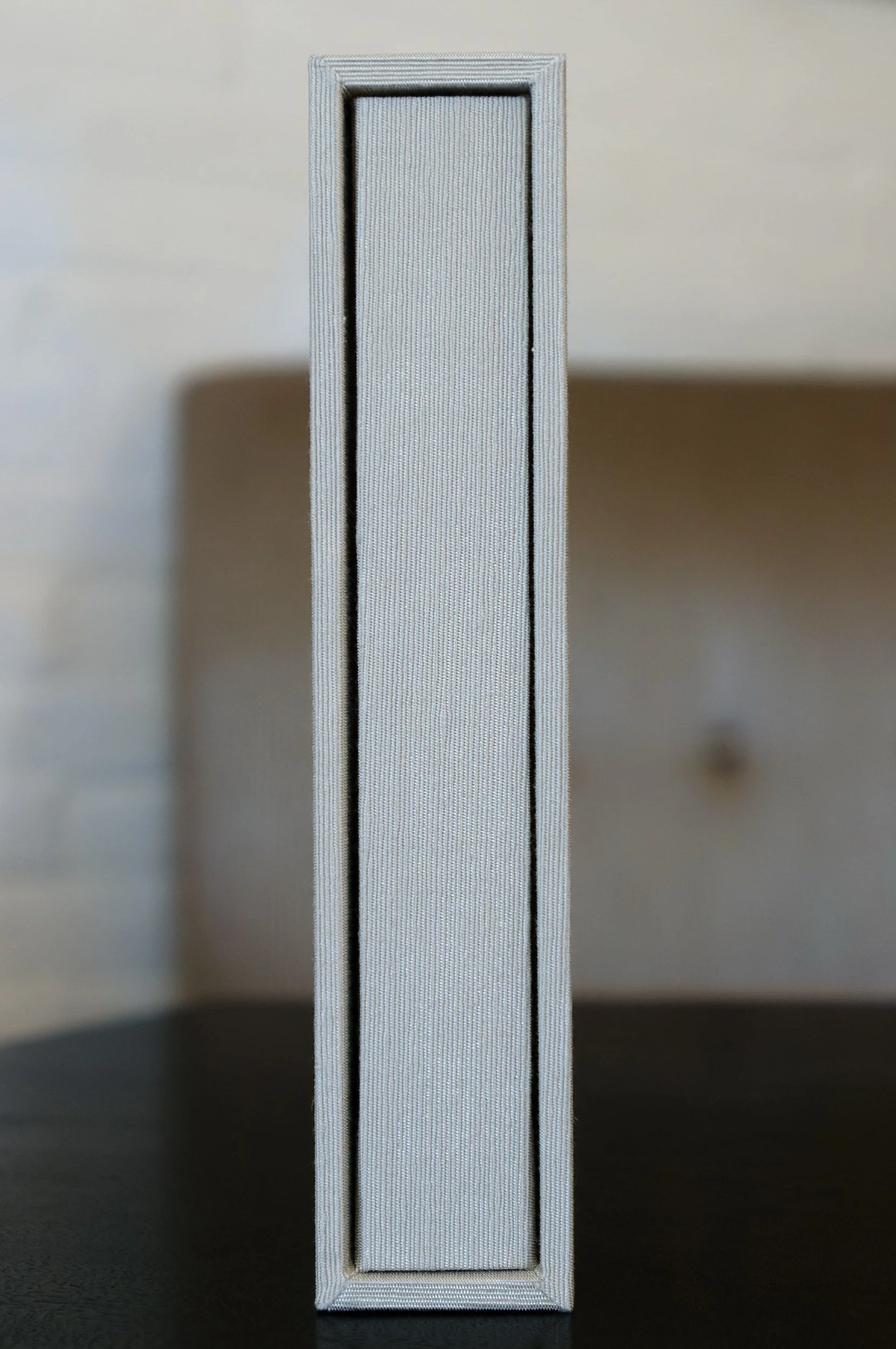 Pearl silk album in slipcase, hand-bound by an expert bookbinder.