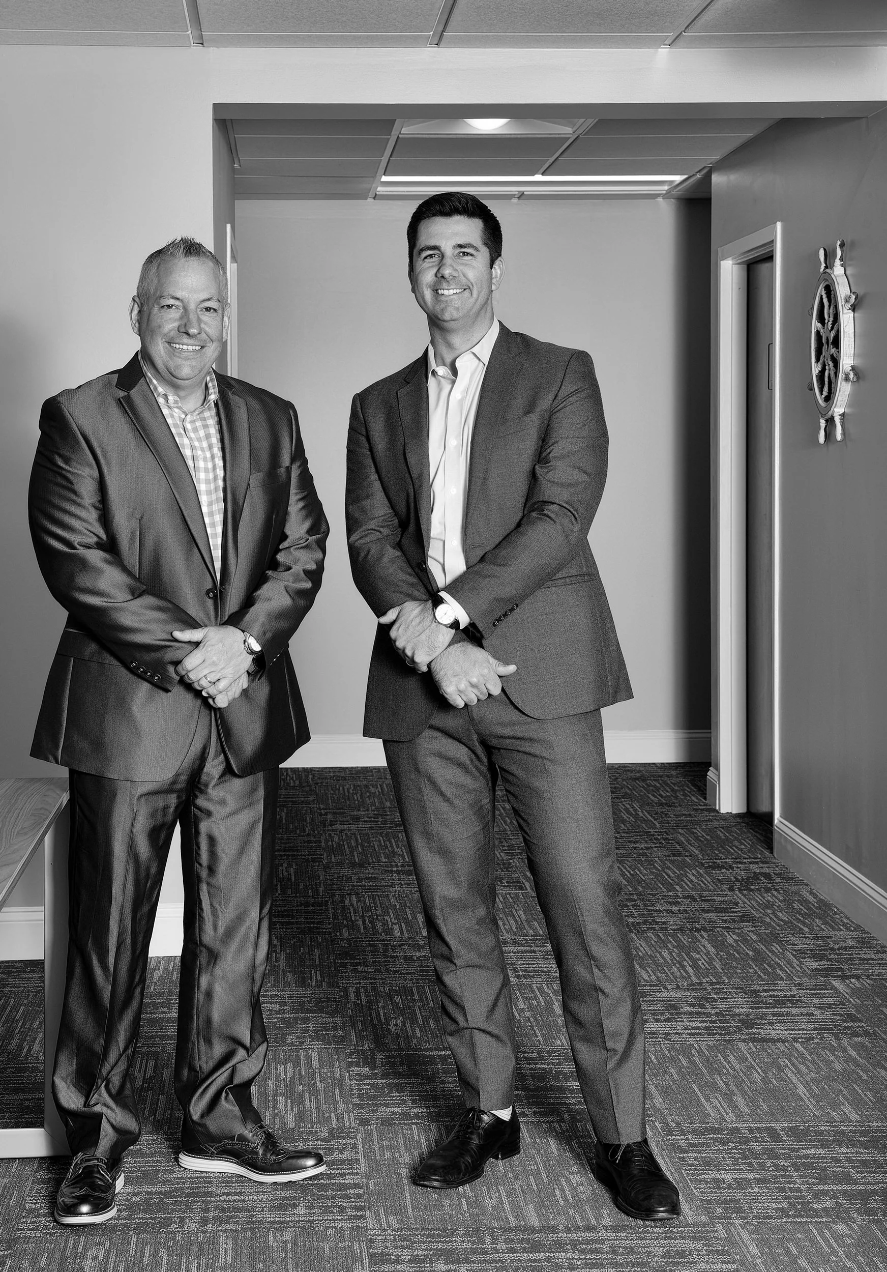 Black-and-white team portrait of Red Hat employees photographed during a professional corporate portrait session.
