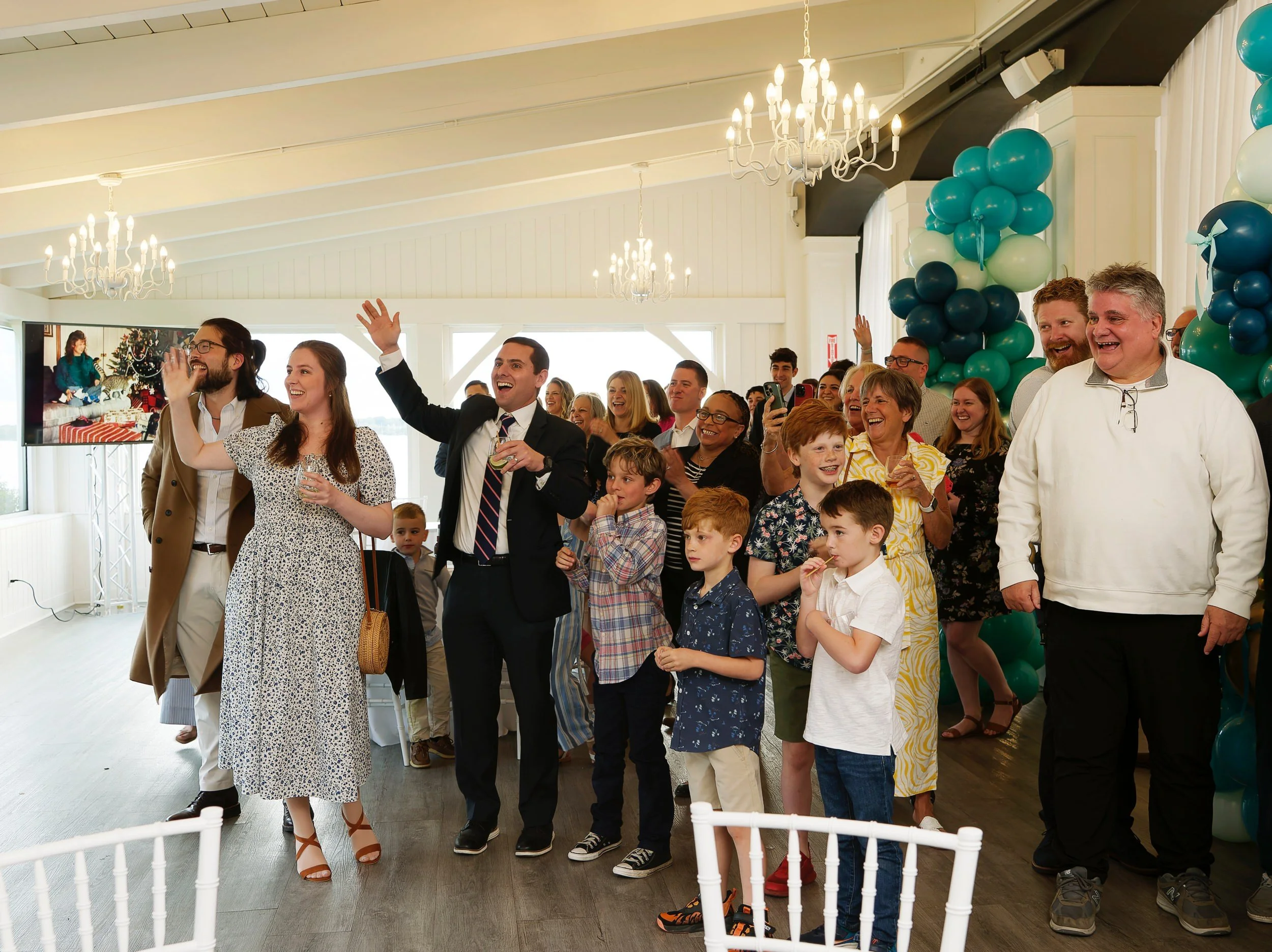 Family surprising Linda and Joe as they arrive to their anniversary celebration
