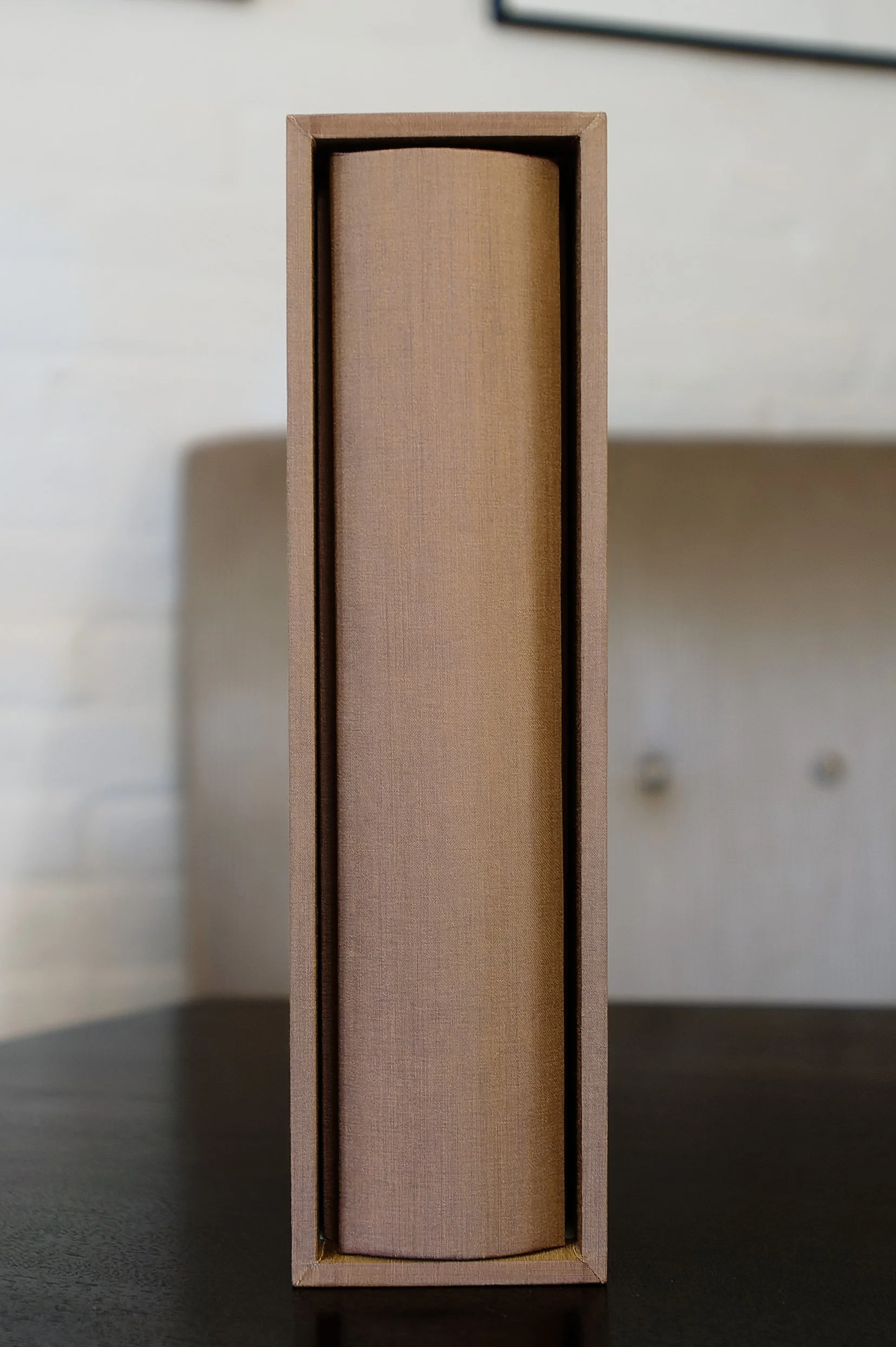 Gold silk album displayed upright