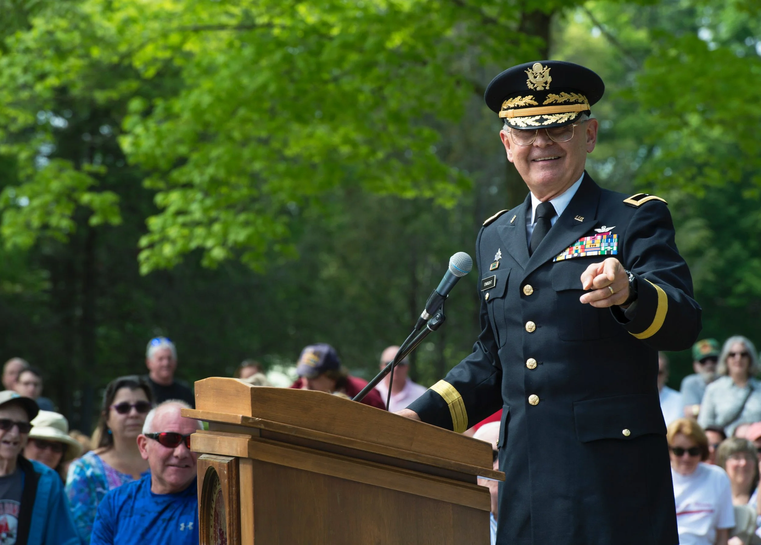 Military officer speaking from the podium during the annual remembrance.