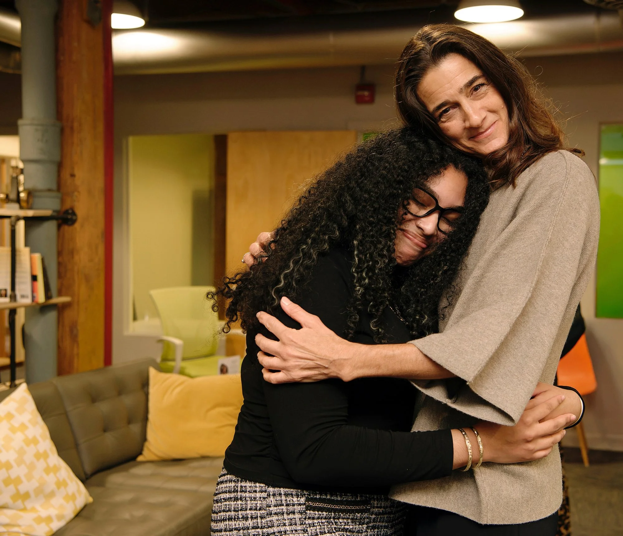 Lisa Marceau and friend embrace at book launch event at New England Medical Innovation Center