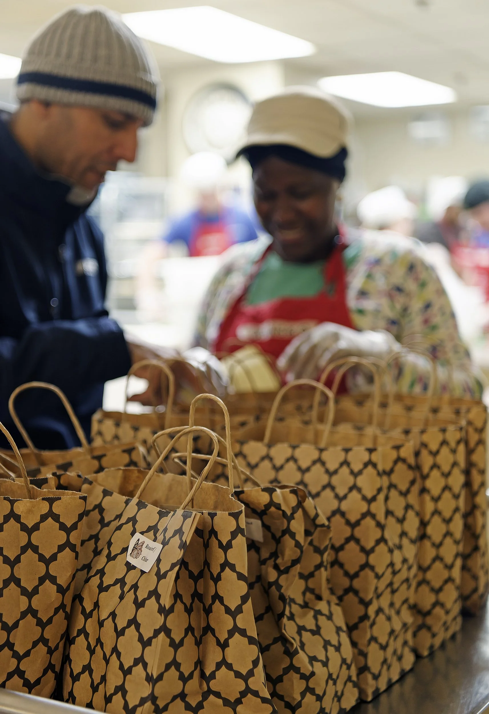 Breakaway Courier volunteer brings surplus prepared meals to Rosie's Place in Boston, MA