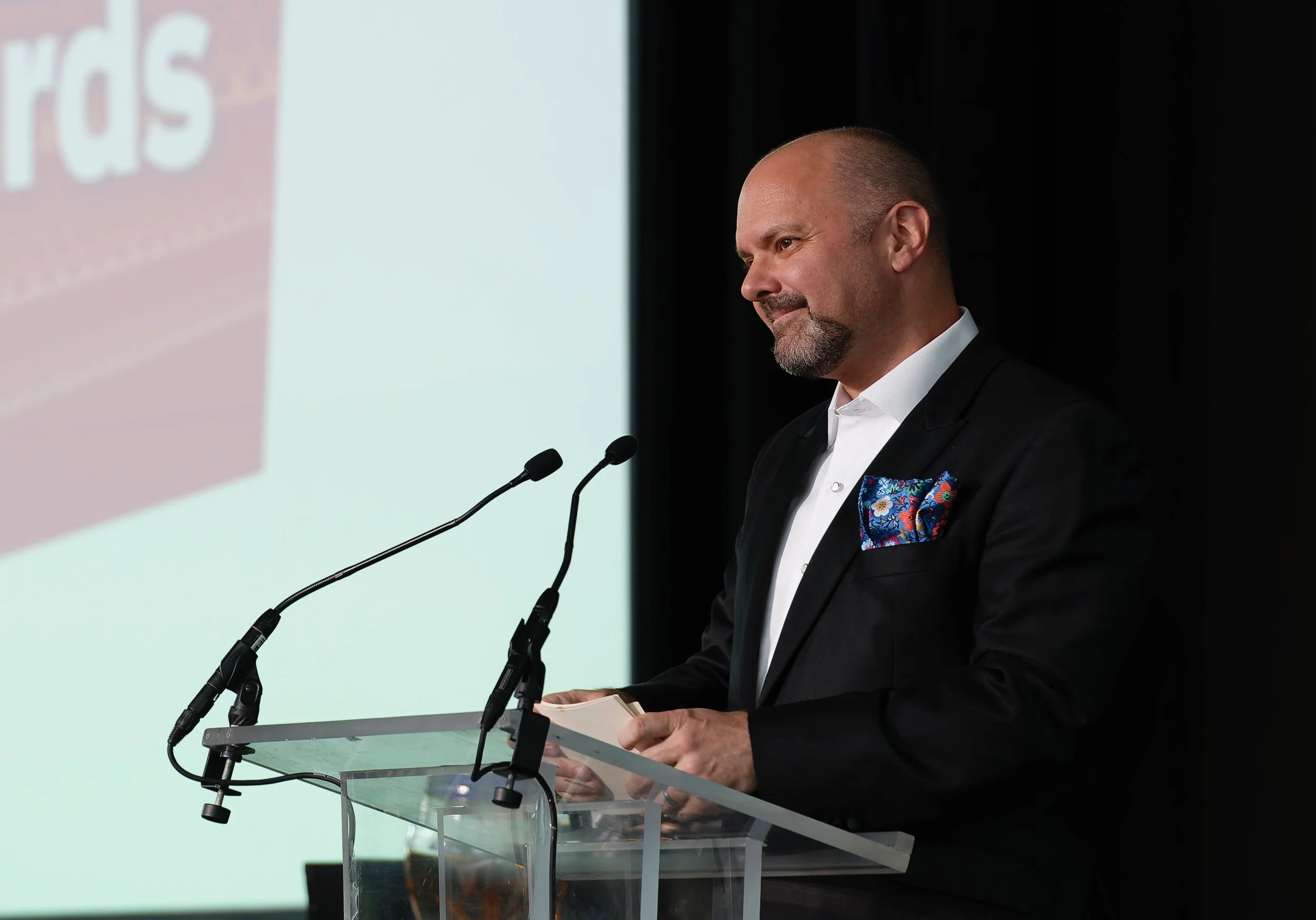 Presenter speaking from the stage during the Pell Awards ceremony