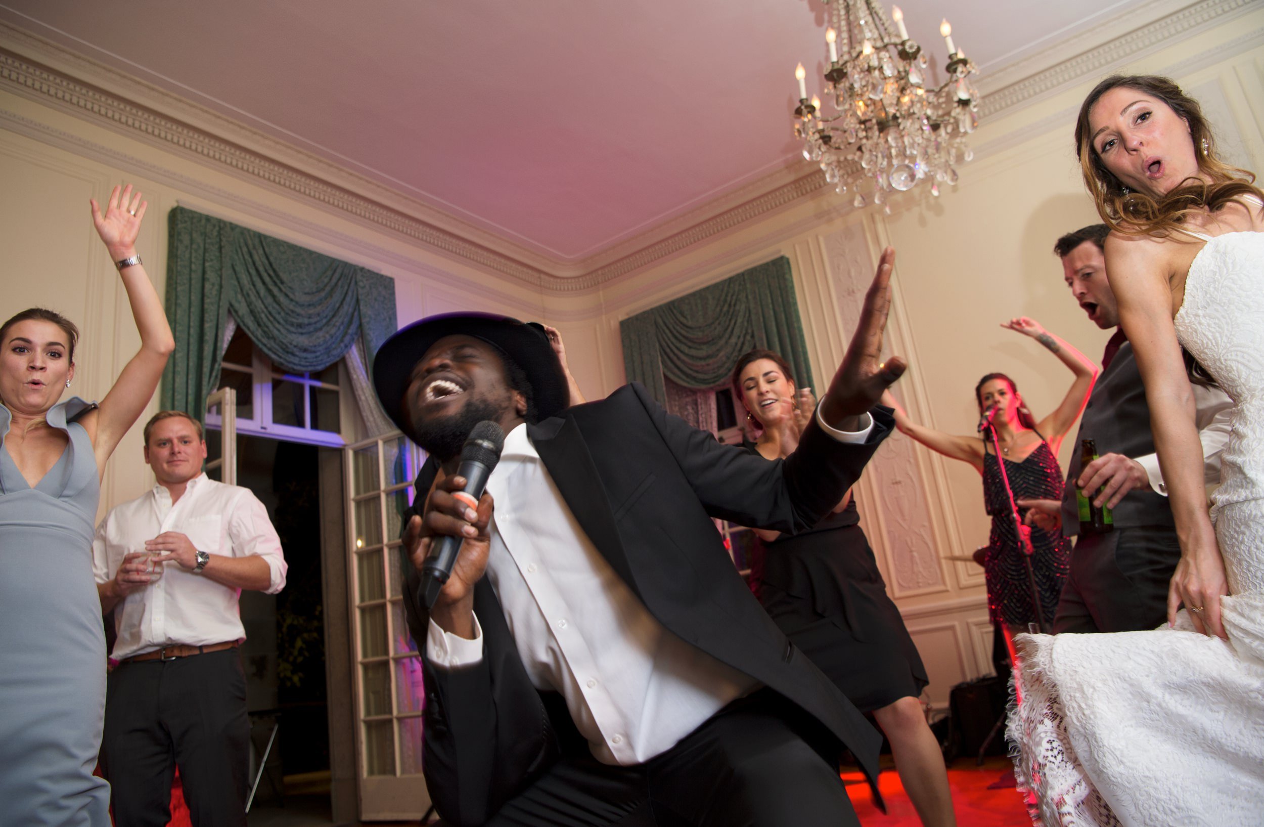 Energetic lead singer of Clockwork Boston entertains bride and guests