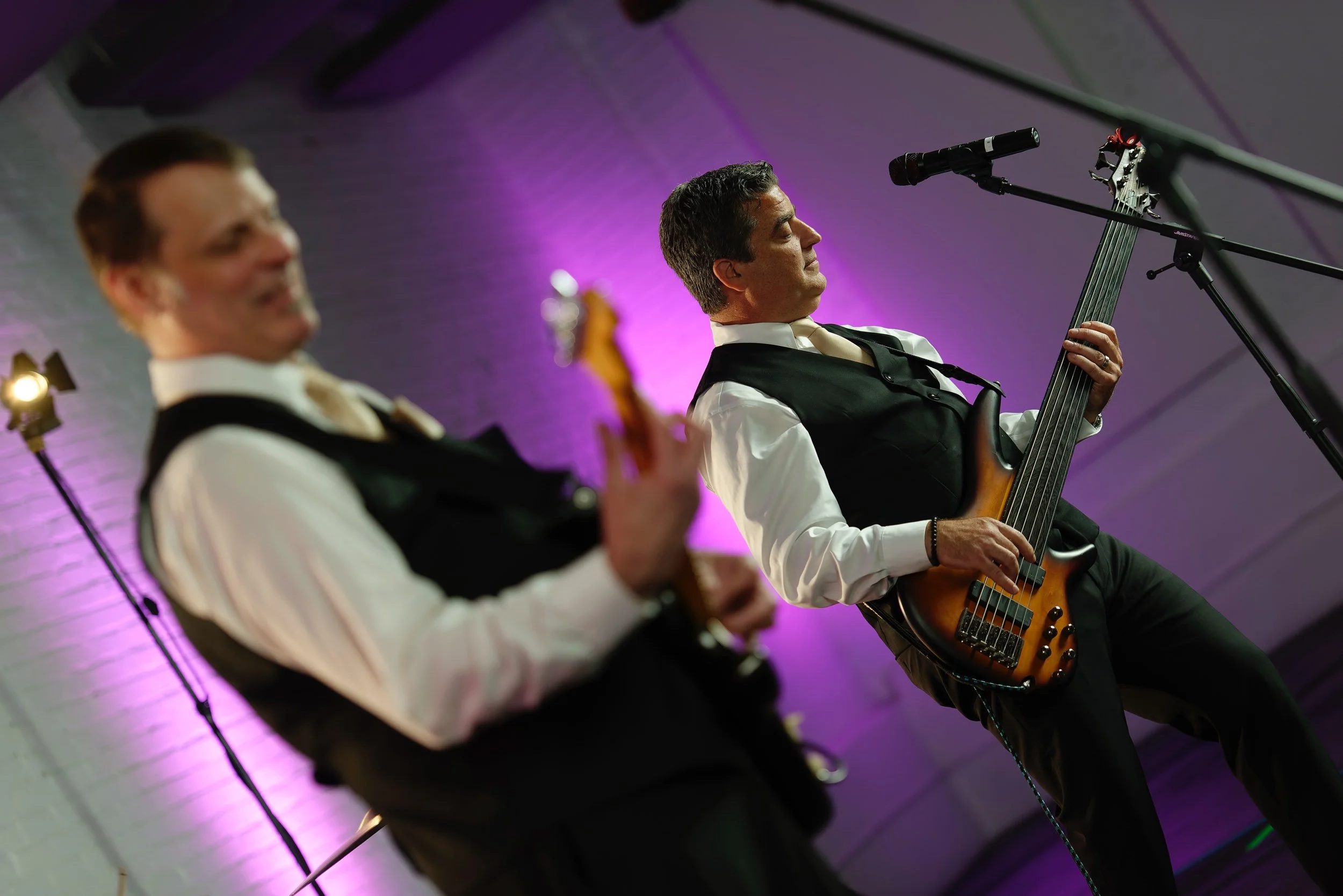 Vibrant color photograph of musicians during production stills of Lucky 13 at Warehouse XI in Somerville, Massachusetts for Hank Agency Group.