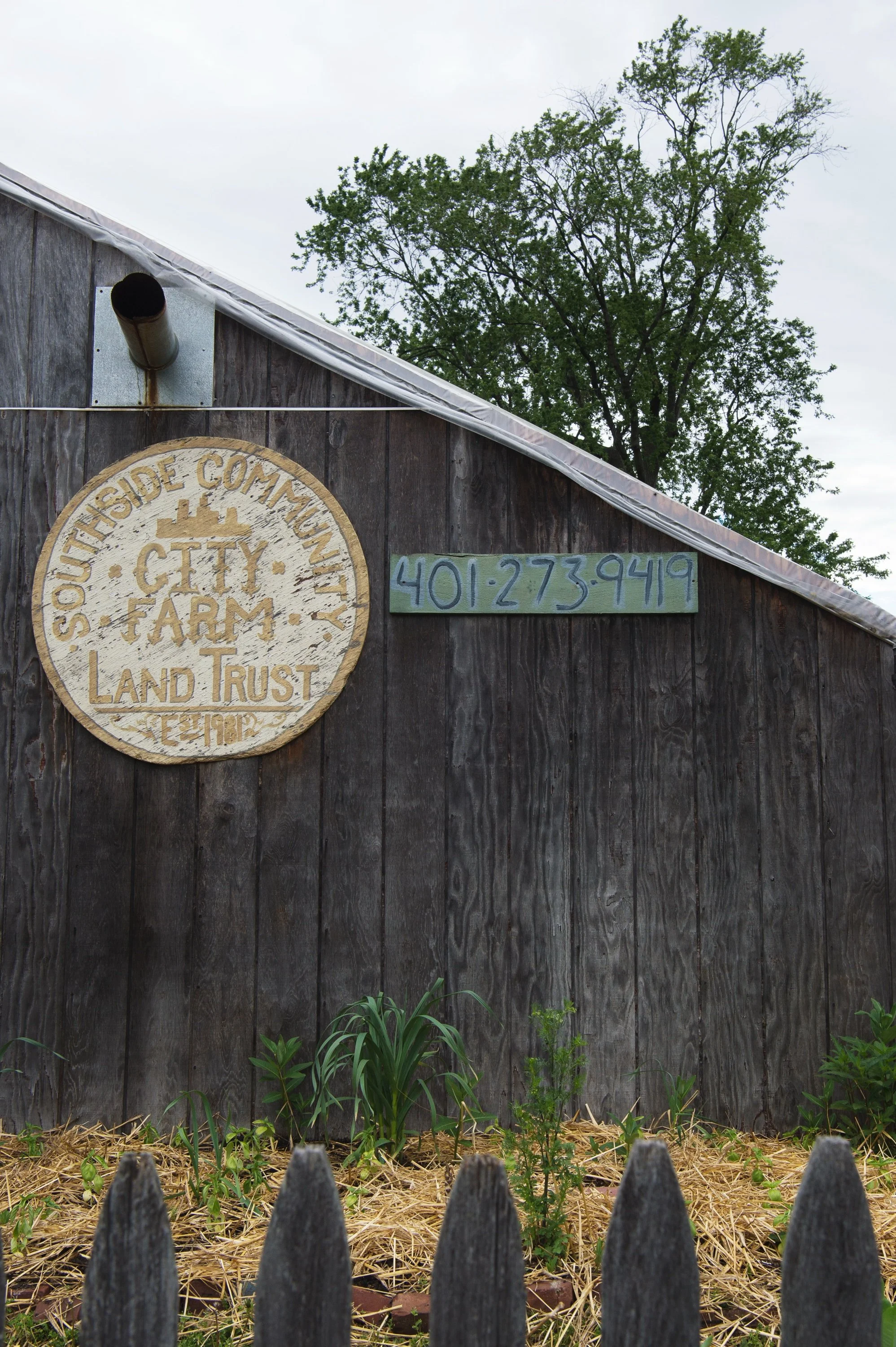Southside Community Land Trust sign on a historic barn in Providence, Rhode Island.