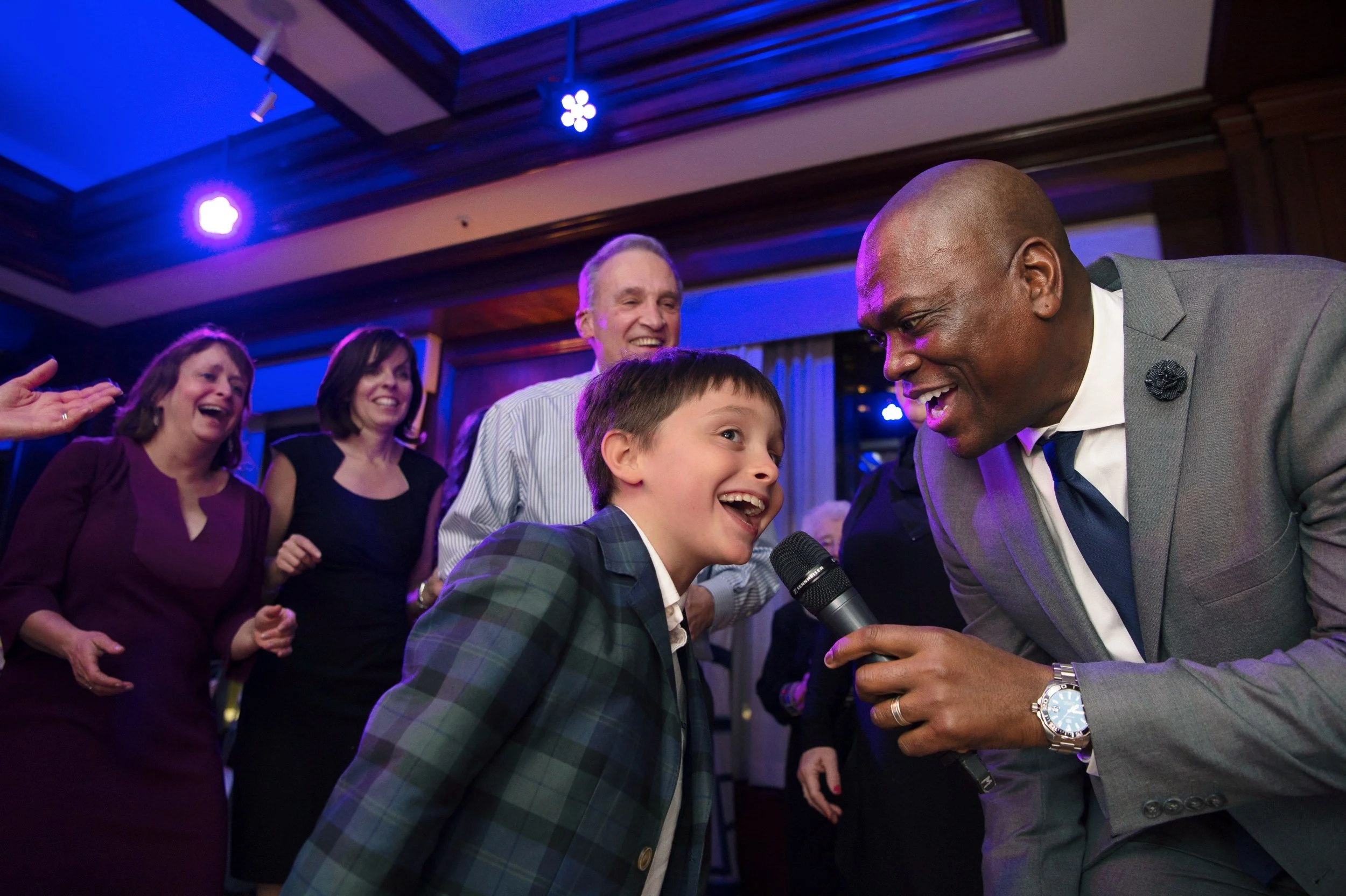 Young guest with Night Shift Entertainment singer on the dance floor at Boston Harbor Hotel event.