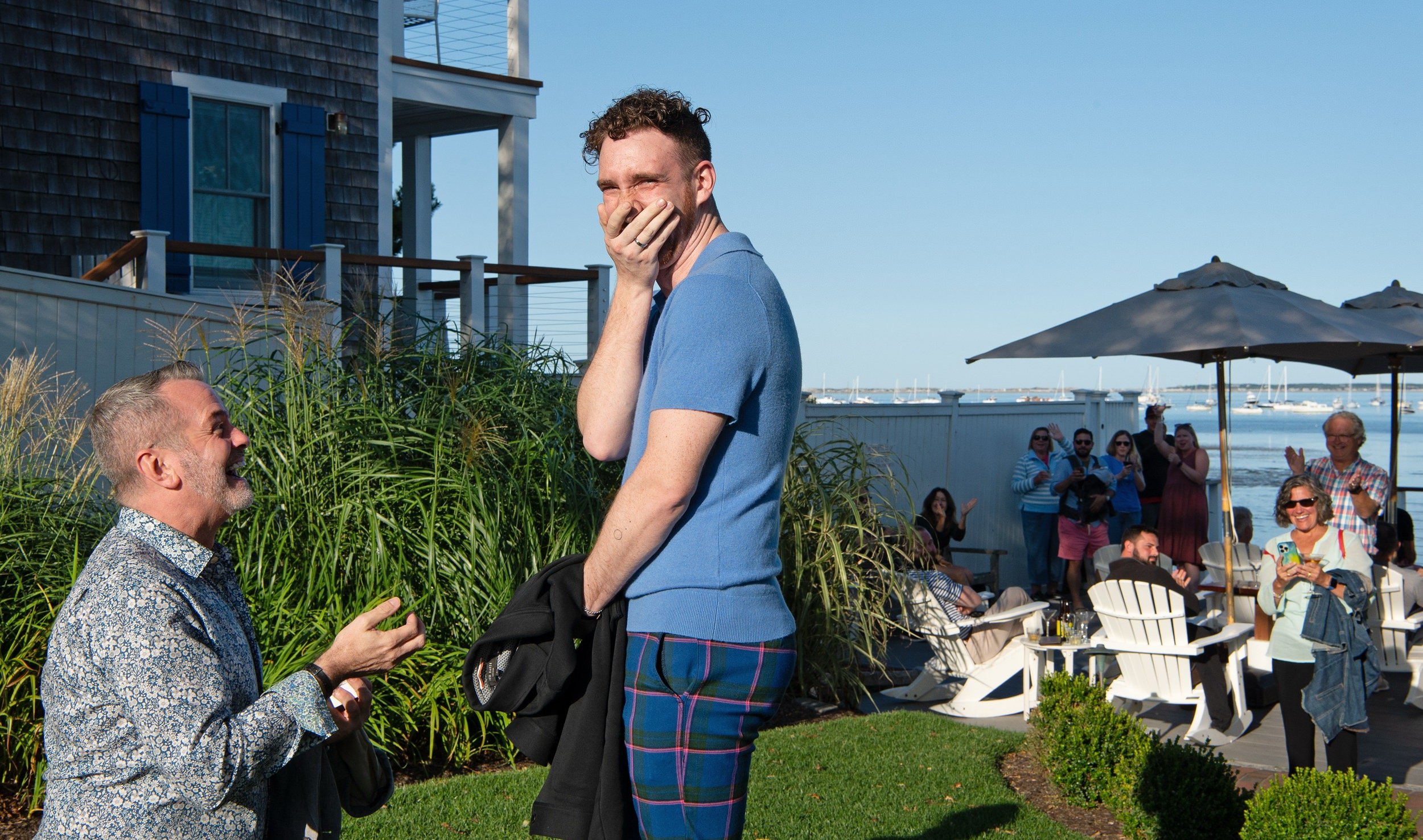 Patrick reacting with joy after the marriage proposal in Provincetown, Massachusetts.