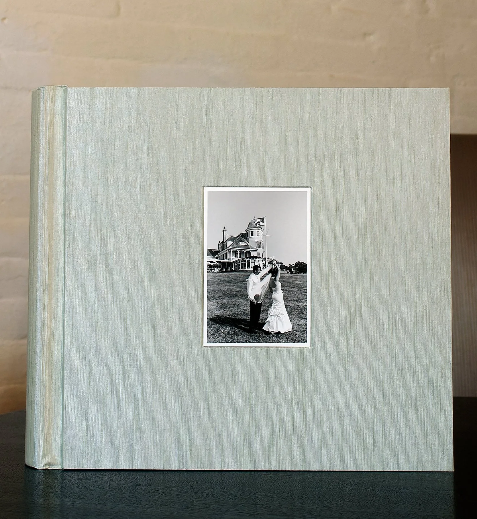 Pale green silk album of Castle Hill Inn wedding album