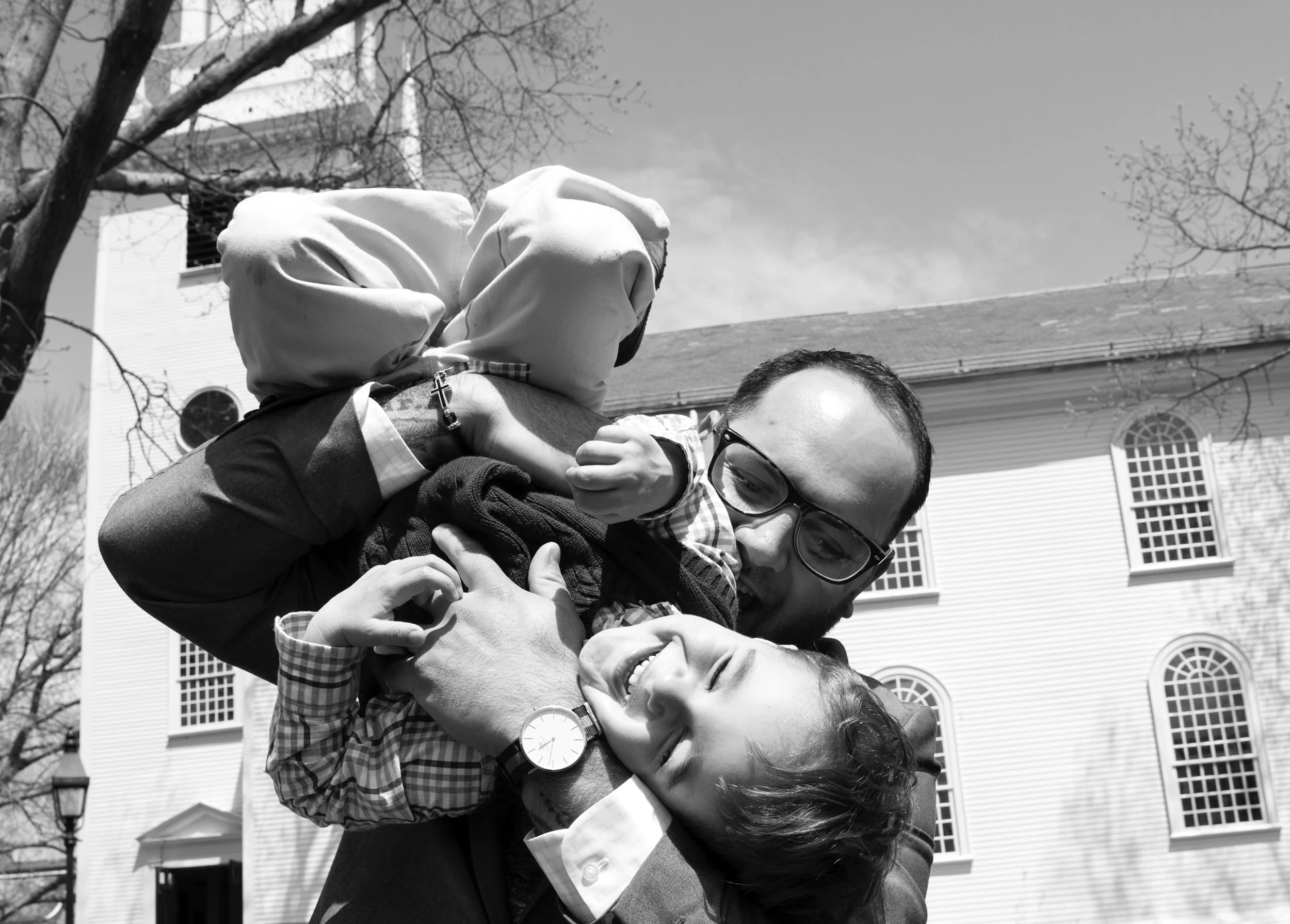 Dad holding child outside Trinity Church