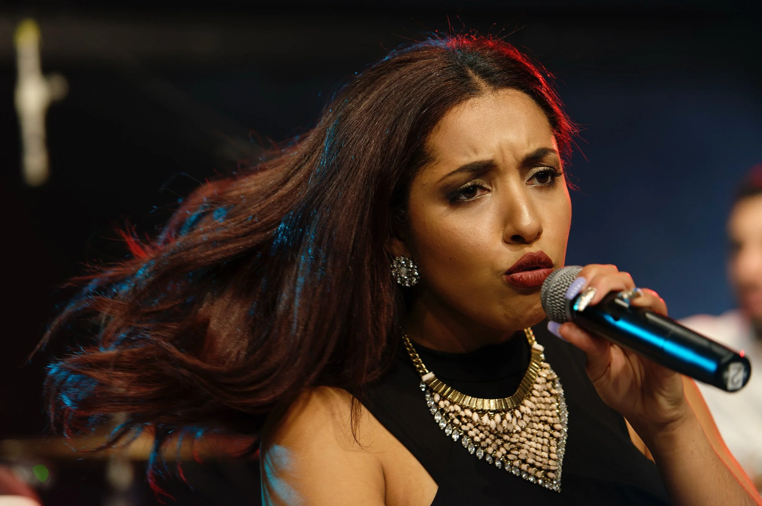 Close-up motion of female lead singer during UMANI music video production at SIR Music Studio in New York City for Hank Agency Group.