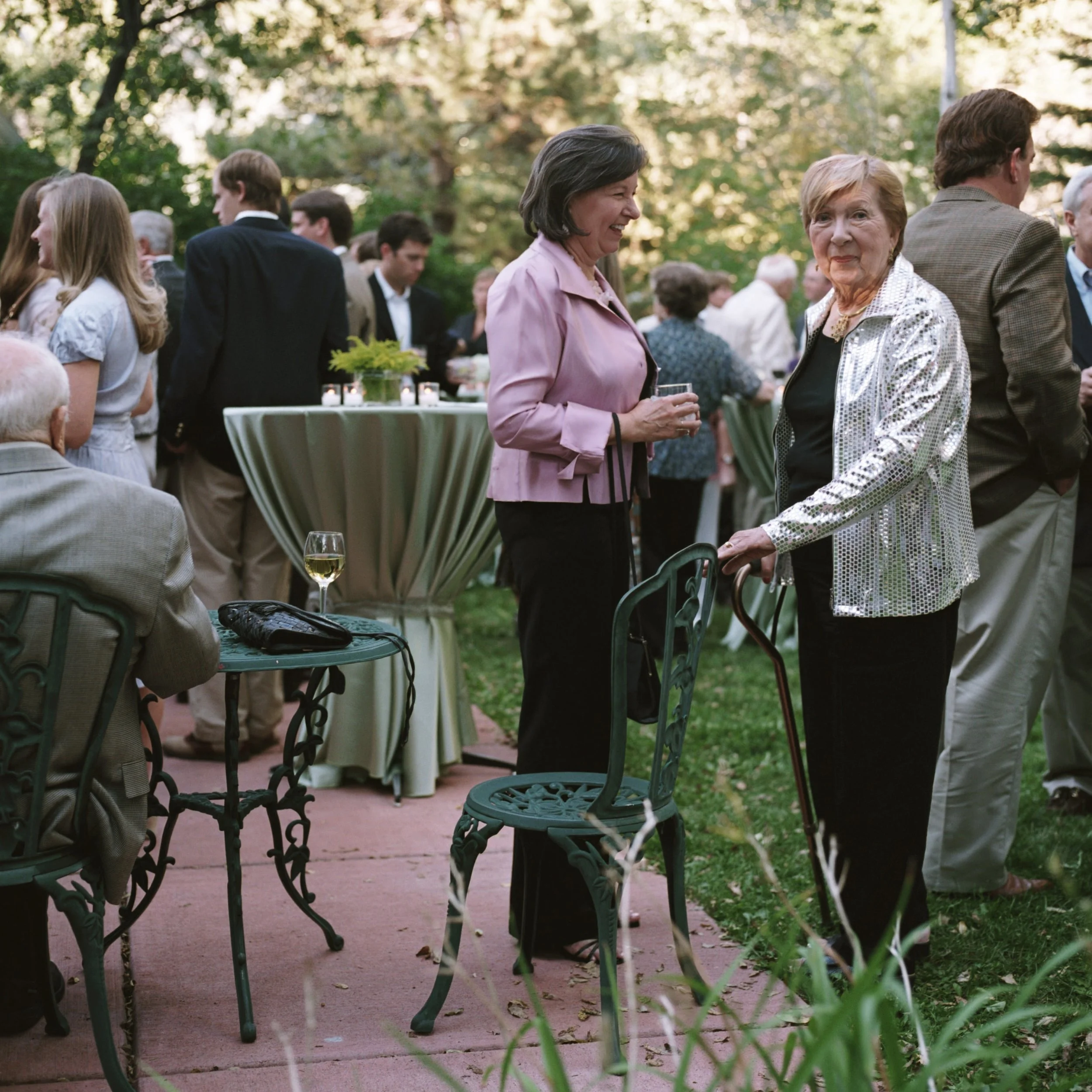 Candid of family during outdoor rehearsal dinner in Aspen, Colorado